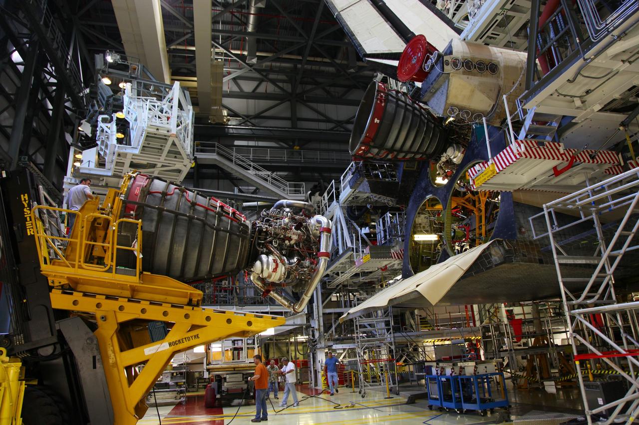 CAPE CANAVERAL, Fla. -- In Orbiter Processing Facility-2 at NASA’s Kennedy Space Center in Florida, technicians, using a Hyster forklift, have removed Engine #3 from space shuttle Atlantis. The engine will be transported to the Engine Shop for possible future use. Each of the three space shuttle main engines is 14 feet long and weighs 7,800 pounds. Removal of the space shuttle main engines is part of the Transition and Retirement work that is being performed in order to prepare Atlantis for eventual display at the Kennedy Space Center Visitor Complex in Florida. Photo credit: Frankie Martin