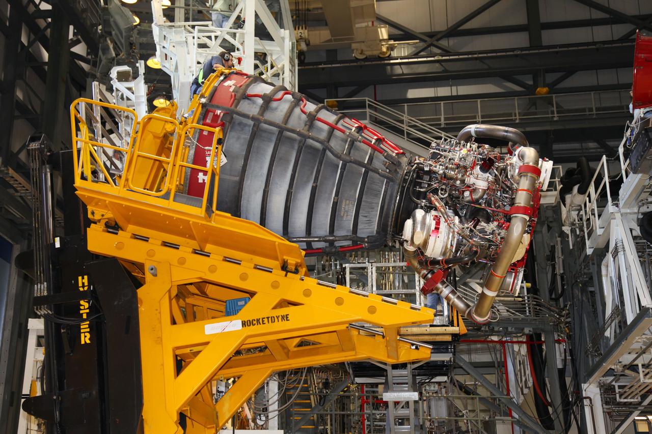 CAPE CANAVERAL, Fla. -- In Orbiter Processing Facility-2 at NASA’s Kennedy Space Center in Florida, technicians use a Hyster forklift to remove Engine #1, the final engine to be removed from space shuttle Atlantis. The forklift will be used to transport the engine to the Engine Shop for possible future use. Each of the three space shuttle main engines is 14 feet long and weighs 7,800 pounds. Removal of the space shuttle main engines is part of the Transition and Retirement work that is being performed in order to prepare Atlantis for eventual display at the Kennedy Space Center Visitor Complex in Florida. Photo credit: Frankie Martin