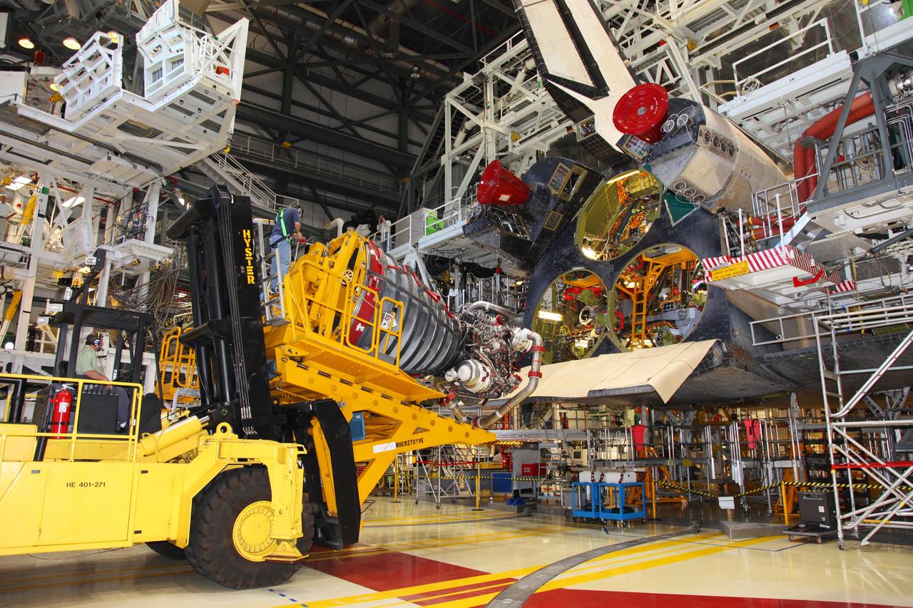 CAPE CANAVERAL, Fla. -- In Orbiter Processing Facility-2 at NASA’s Kennedy Space Center in Florida, technicians used a Hyster forklift to remove Engine #1, the final engine to be removed from space shuttle Atlantis. The forklift will be used to transport the engine to the Engine Shop for possible future use. Each of the three space shuttle main engines is 14 feet long and weighs 7,800 pounds. Removal of the space shuttle main engines is part of the Transition and Retirement work that is being performed in order to prepare Atlantis for eventual display at the Kennedy Space Center Visitor Complex in Florida. Photo credit: Frankie Martin