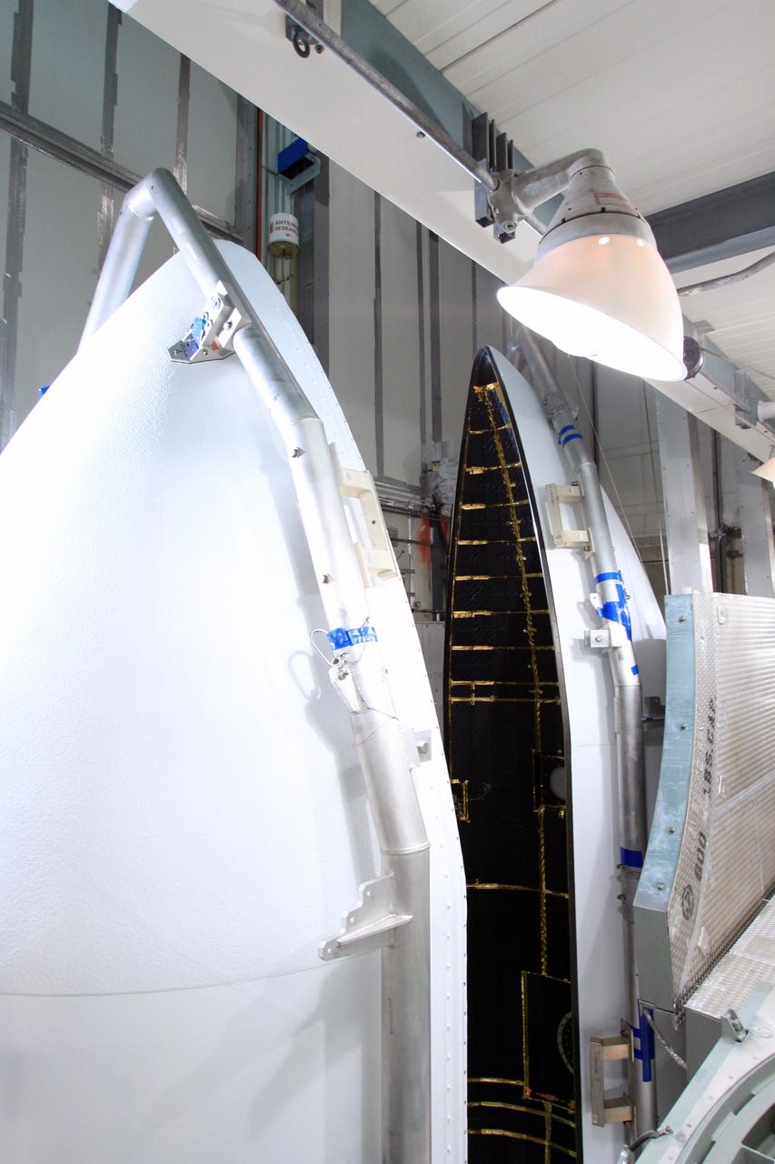 CAPE CANAVERAL, Fla. -- At Space Launch Complex 17B on Cape Canaveral Air Force Station in Florida, the sections of the clamshell-shaped Delta payload fairing close in around NASA's twin Gravity Recovery and Interior Laboratory spacecraft.    The fairing will protect the spacecraft from the impact of aerodynamic pressure and heating during ascent and will be jettisoned once the spacecraft is outside the Earth's atmosphere. Launch aboard a United Launch Alliance Delta II rocket from Pad 17B is scheduled for Sept. 8.  The spacecraft will fly in tandem orbits around the moon for several months to measure its gravity field. GRAIL's primary science objectives are to determine the structure of the lunar interior, from crust to core, and to advance understanding of the thermal evolution of the moon.  For more information, visit http://www.nasa.gov/grail. Photo credit: NASA/Jim Grossmann