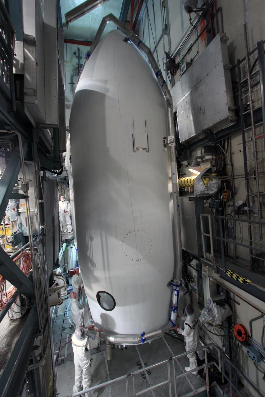 CAPE CANAVERAL, Fla. -- At Space Launch Complex 17B on Cape Canaveral Air Force Station in Florida, the sections of the Delta payload fairing form a protective cocoon around NASA's twin Gravity Recovery and Interior Laboratory spacecraft.    The fairing will protect the spacecraft from the impact of aerodynamic pressure and heating during ascent and will be jettisoned once the spacecraft is outside the Earth's atmosphere. Launch aboard a United Launch Alliance Delta II rocket from Pad 17B is scheduled for Sept. 8.  The spacecraft will fly in tandem orbits around the moon for several months to measure its gravity field. GRAIL's primary science objectives are to determine the structure of the lunar interior, from crust to core, and to advance understanding of the thermal evolution of the moon.  For more information, visit http://www.nasa.gov/grail. Photo credit: NASA/Jim Grossmann