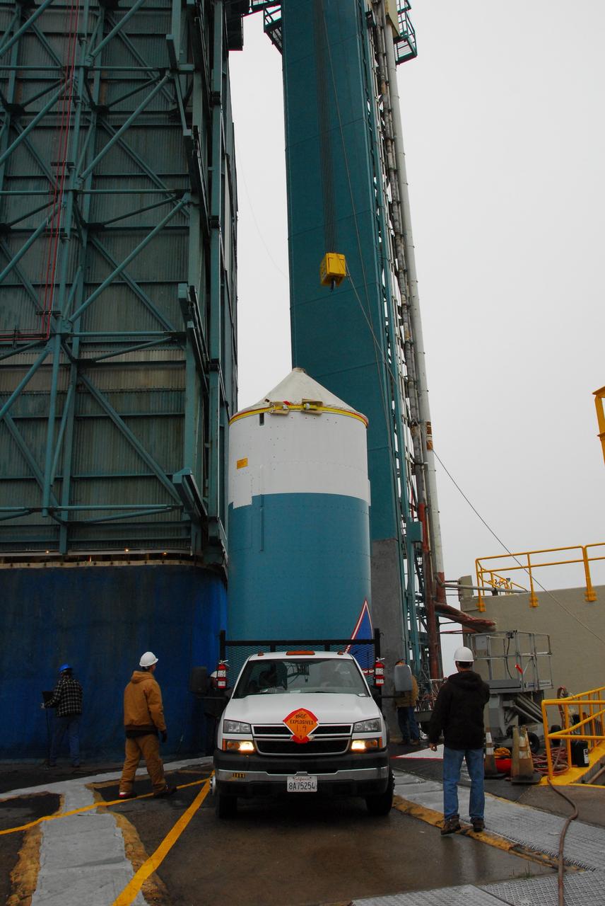 VANDENBERG AIR FORCE BASE, Calif. -- At NASA's Space Launch Complex-2 on Vandenberg Air Force Base in California, preparations are under way to attach the interstage of the United Launch Alliance Delta II that will carry NASA's National Polar-orbiting Operational Environmental Satellite System Preparatory Project (NPP) satellite into space to a lifting device.    The interstage provides an interface between the launch vehicle's first and second stages. NPP represents a critical first step in building the next-generation of Earth-observing satellites. NPP will carry the first of the new sensors developed for this satellite fleet, now known as the Joint Polar Satellite System (JPSS) to be launched in 2016. NPP is the bridge between NASA's Earth Observing System (EOS) satellites and the forthcoming series of JPSS satellites. The mission will test key technologies and instruments for the JPSS missions. For more information, visit http://www.nasa.gov/NPP. Photo credit: NASA/VAFB, Rudy Bledsoe