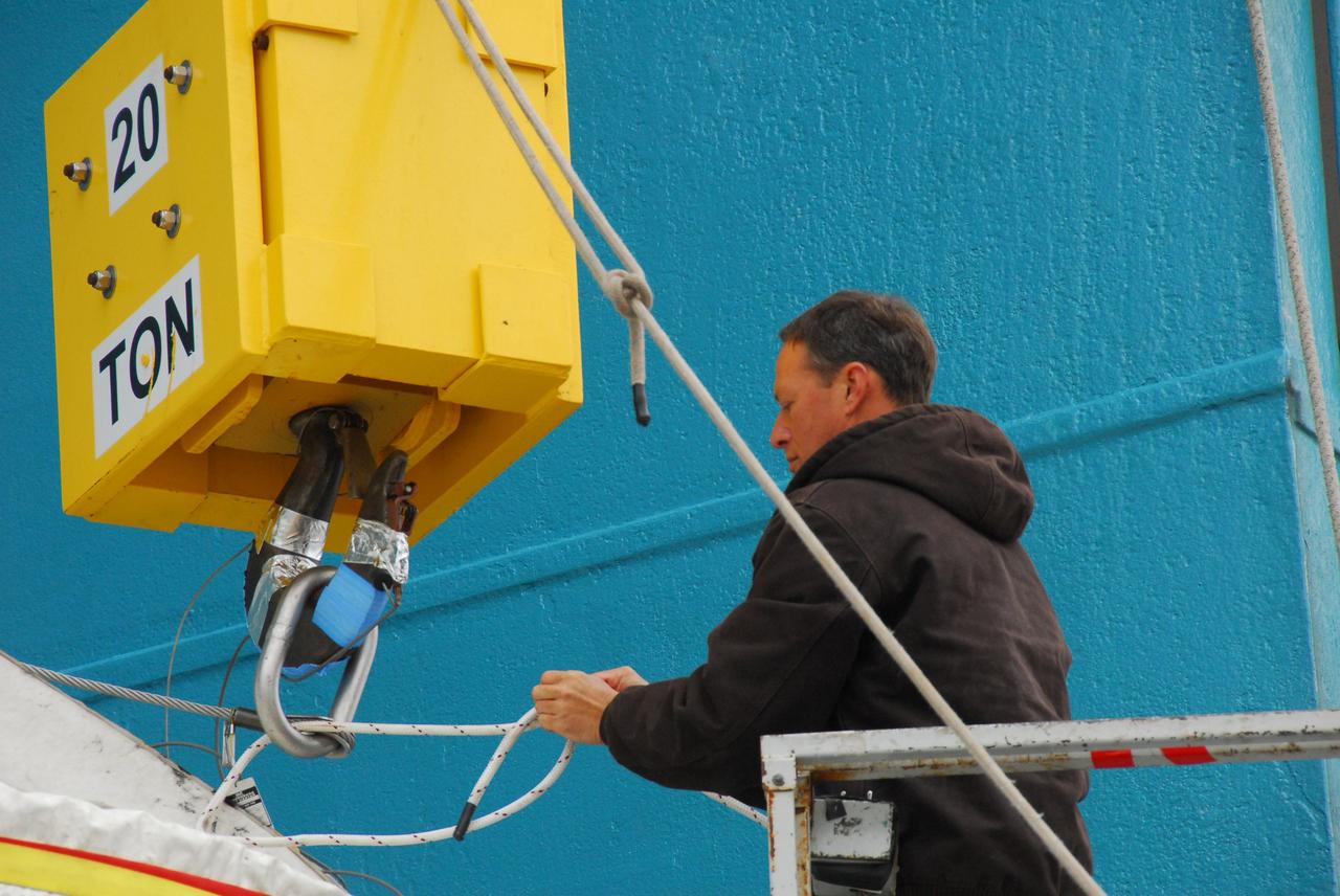 VANDENBERG AIR FORCE BASE, Calif. -- At NASA's Space Launch Complex-2 on Vandenberg Air Force Base in California, a spacecraft technician secures the interstage of the United Launch Alliance Delta II that will carry NASA's National Polar-orbiting Operational Environmental Satellite System Preparatory Project (NPP) satellite into space to a lifting device.    The interstage provides an interface between the launch vehicle's first and second stages. NPP represents a critical first step in building the next-generation of Earth-observing satellites. NPP will carry the first of the new sensors developed for this satellite fleet, now known as the Joint Polar Satellite System (JPSS) to be launched in 2016. NPP is the bridge between NASA's Earth Observing System (EOS) satellites and the forthcoming series of JPSS satellites. The mission will test key technologies and instruments for the JPSS missions. For more information, visit http://www.nasa.gov/NPP. Photo credit: NASA/VAFB, Rudy Bledsoe