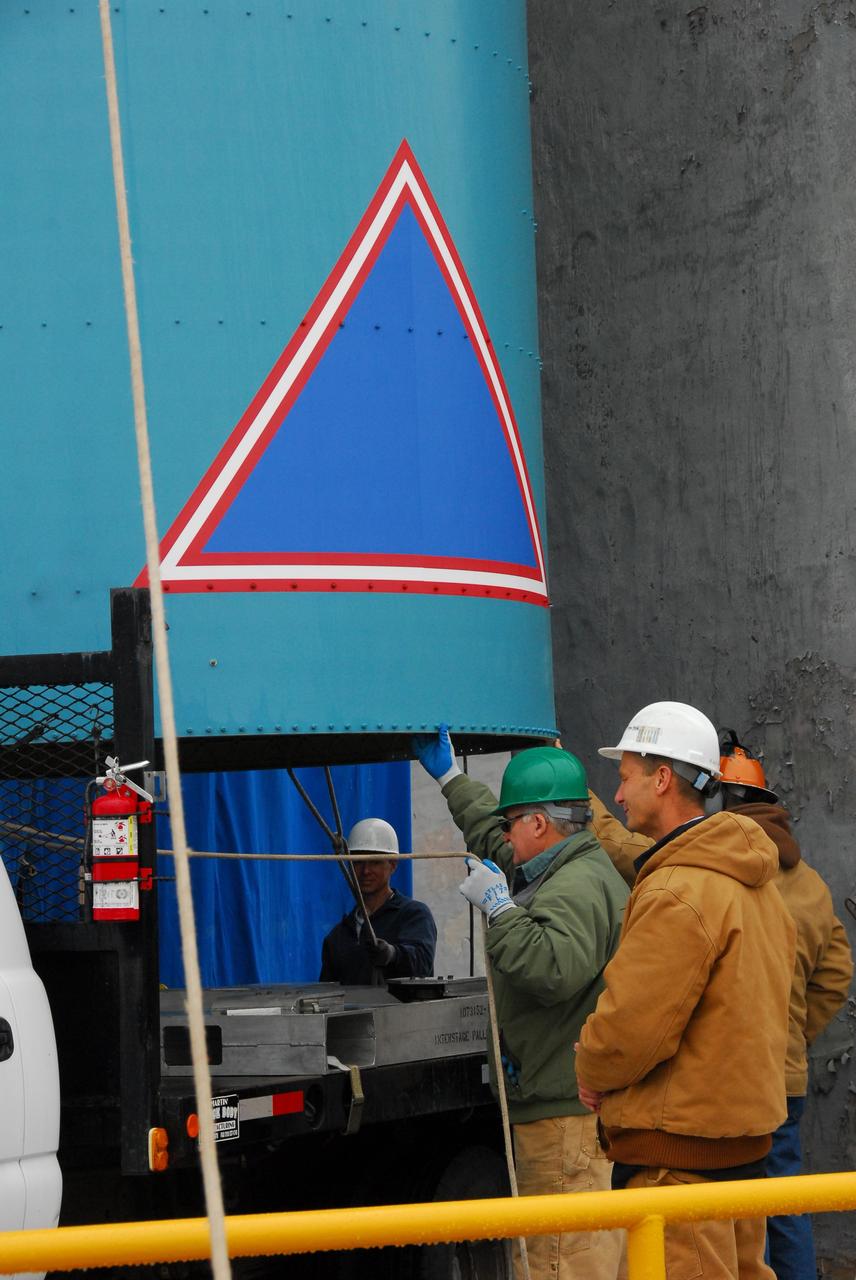 VANDENBERG AIR FORCE BASE, Calif. -- At NASA's Space Launch Complex-2 on Vandenberg Air Force Base in California, spacecraft technicians oversee the lift of the interstage of the United Launch Alliance Delta II that will carry NASA's National Polar-orbiting Operational Environmental Satellite System Preparatory Project (NPP) satellite into space from its transporter.    The interstage provides an interface between the launch vehicle's first and second stages. NPP represents a critical first step in building the next-generation of Earth-observing satellites. NPP will carry the first of the new sensors developed for this satellite fleet, now known as the Joint Polar Satellite System (JPSS) to be launched in 2016. NPP is the bridge between NASA's Earth Observing System (EOS) satellites and the forthcoming series of JPSS satellites. The mission will test key technologies and instruments for the JPSS missions. For more information, visit http://www.nasa.gov/NPP. Photo credit: NASA/VAFB, Rudy Bledsoe