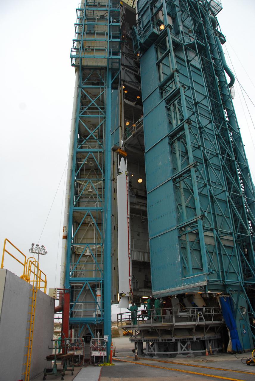 VANDENBERG AIR FORCE BASE, Calif. -- At Vandenberg Air Force Base in California, a solid rocket motor for the United Launch Alliance Delta II that will carry NASA's National Polar-orbiting Operational Environmental Satellite System Preparatory Project (NPP) satellite is hoisted up at NASA's Space Launch Complex-2. NPP represents a critical first step in building the next-generation of Earth-observing satellites. NPP will carry the first of the new sensors developed for this satellite fleet, now known as the Joint Polar Satellite System (JPSS) to be launched in 2016. NPP is the bridge between NASA's Earth Observing System (EOS) satellites and the forthcoming series of JPSS satellites. The mission will test key technologies and instruments for the JPSS missions. NPP is targeted to launch Oct. 25. For more information, visit http://www.nasa.gov/NPP. Photo credit: NASA/VAFB, Dan Liberotti