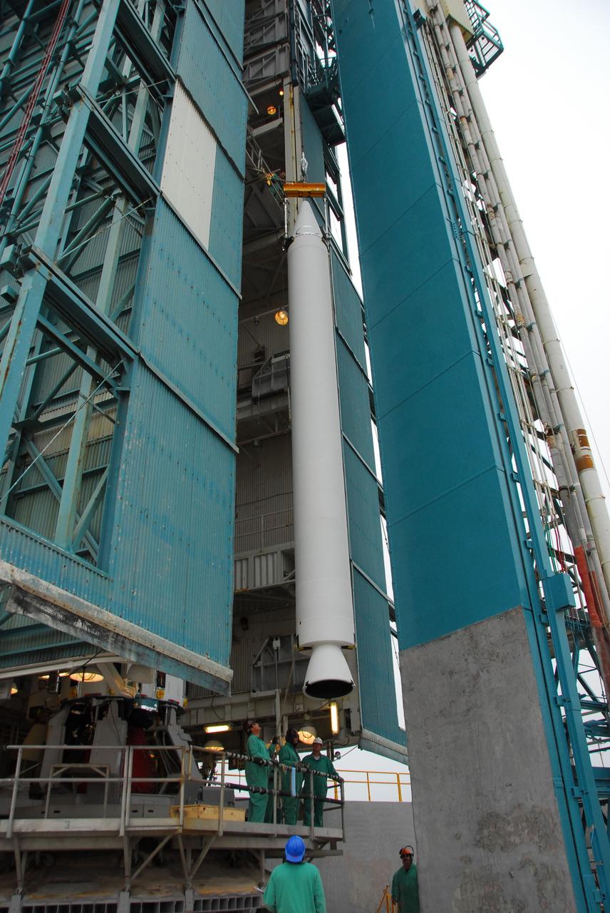 VANDENBERG AIR FORCE BASE, Calif. -- At Vandenberg Air Force Base in California, technicians monitor the progress as a solid rocket motor for the United Launch Alliance Delta II that will carry NASA's National Polar-orbiting Operational Environmental Satellite System Preparatory Project (NPP) satellite is hoisted up at NASA's Space Launch Complex-2. NPP represents a critical first step in building the next-generation of Earth-observing satellites. NPP will carry the first of the new sensors developed for this satellite fleet, now known as the Joint Polar Satellite System (JPSS) to be launched in 2016. NPP is the bridge between NASA's Earth Observing System (EOS) satellites and the forthcoming series of JPSS satellites. The mission will test key technologies and instruments for the JPSS missions. NPP is targeted to launch Oct. 25. For more information, visit http://www.nasa.gov/NPP. Photo credit: NASA/VAFB, Dan Liberotti