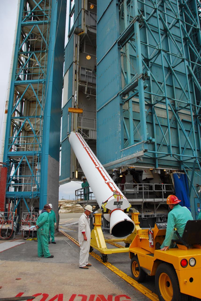 VANDENBERG AIR FORCE BASE, Calif. -- At Vandenberg Air Force Base in California, technicians use a crane to lift a solid rocket motor for the United Launch Alliance Delta II that will carry NASA's National Polar-orbiting Operational Environmental Satellite System Preparatory Project (NPP) satellite at NASA's Space Launch Complex-2. NPP represents a critical first step in building the next-generation of Earth-observing satellites. NPP will carry the first of the new sensors developed for this satellite fleet, now known as the Joint Polar Satellite System (JPSS) to be launched in 2016. NPP is the bridge between NASA's Earth Observing System (EOS) satellites and the forthcoming series of JPSS satellites. The mission will test key technologies and instruments for the JPSS missions. NPP is targeted to launch Oct. 25. For more information, visit http://www.nasa.gov/NPP. Photo credit: NASA/VAFB, Dan Liberotti