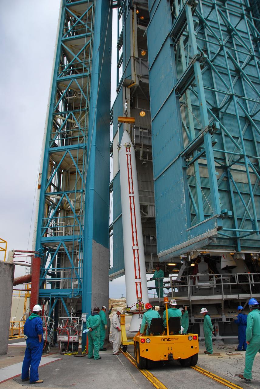 VANDENBERG AIR FORCE BASE, Calif. -- At Vandenberg Air Force Base in California, technicians use a crane to lift a solid rocket motor for the United Launch Alliance Delta II that will carry NASA's National Polar-orbiting Operational Environmental Satellite System Preparatory Project (NPP) satellite at NASA's Space Launch Complex-2. NPP represents a critical first step in building the next-generation of Earth-observing satellites. NPP will carry the first of the new sensors developed for this satellite fleet, now known as the Joint Polar Satellite System (JPSS) to be launched in 2016. NPP is the bridge between NASA's Earth Observing System (EOS) satellites and the forthcoming series of JPSS satellites. The mission will test key technologies and instruments for the JPSS missions. NPP is targeted to launch Oct. 25. For more information, visit http://www.nasa.gov/NPP. Photo credit: NASA/VAFB, Dan Liberotti