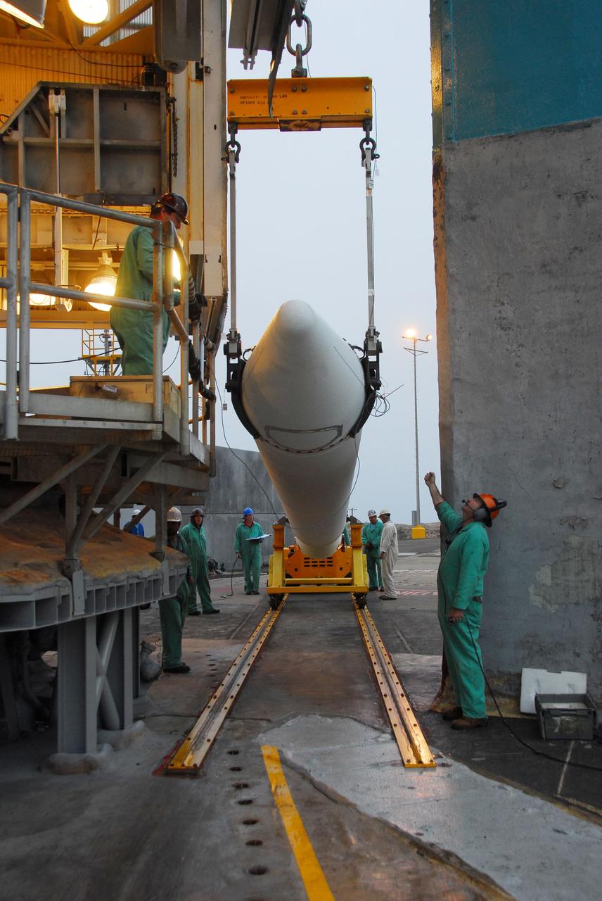 VANDENBERG AIR FORCE BASE, Calif. -- At Vandenberg Air Force Base in California, a crane is used to hoist up a solid rocket motor for the United Launch Alliance Delta II that will carry NASA's National Polar-orbiting Operational Environmental Satellite System Preparatory Project (NPP) satellite into space at NASA's Space Launch Complex-2. NPP represents a critical first step in building the next-generation of Earth-observing satellites. NPP will carry the first of the new sensors developed for this satellite fleet, now known as the Joint Polar Satellite System (JPSS) to be launched in 2016. NPP is the bridge between NASA's Earth Observing System (EOS) satellites and the forthcoming series of JPSS satellites. The mission will test key technologies and instruments for the JPSS missions. NPP is targeted to launch Oct. 25. For more information, visit http://www.nasa.gov/NPP. Photo credit: NASA/VAFB, Dan Liberotti