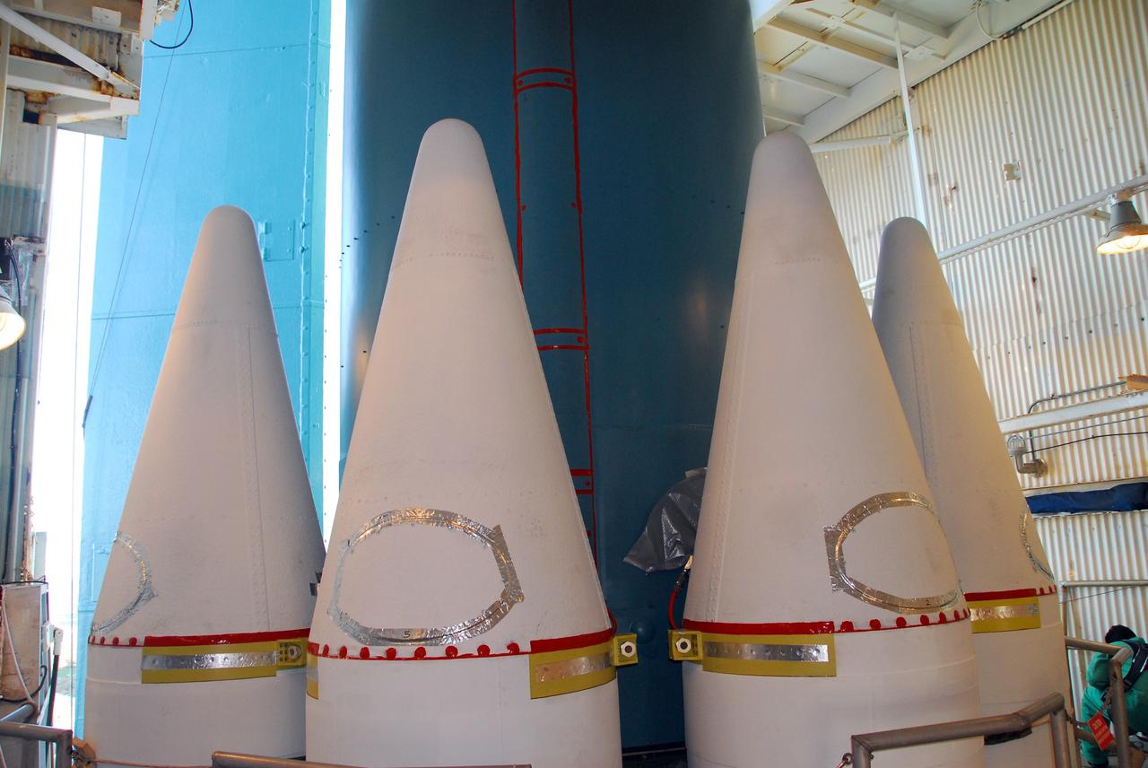 VANDENBERG AIR FORCE BASE, Calif. -- At NASA’s Space Launch Complex-2 at Vandenberg Air Force Base in California, several solid rocket motor closers have been attached to the United Launch Alliance Delta II rocket. The Delta II will carry NASA’s National Polar-orbiting Operational Environmental Satellite System Preparatory Project (NPP) satellite into space. NPP represents a critical first step in building the next-generation of Earth-observing satellites. NPP will carry the first of the new sensors developed for this satellite fleet, now known as the Joint Polar Satellite System (JPSS) to be launched in 2016. NPP is the bridge between NASA's Earth Observing System (EOS) satellites and the forthcoming series of JPSS satellites. The mission will test key technologies and instruments for the JPSS missions. NPP is targeted to launch Oct. 25. For more information, visit http://www.nasa.gov/NPP. Photo credit: NASA/VAFB, Mark Mackley