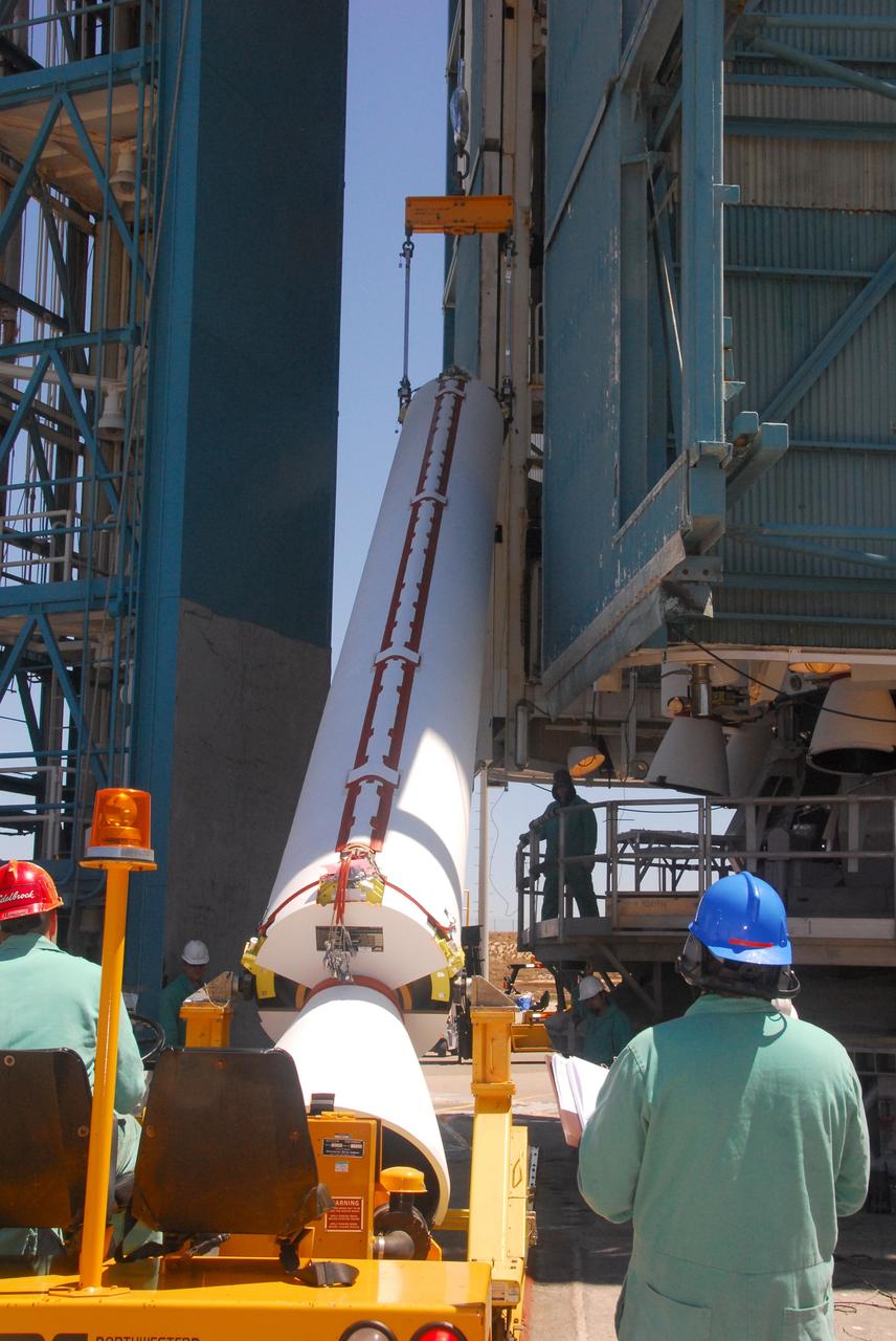 VANDENBERG AIR FORCE BASE, Calif. -- At Space Launch Complex-2 at Vandenberg Air Force Base in California, a crane lifts a solid rocket motor for attachment to the United Launch Alliance Delta II rocket. The Delta II will carry NASA’s National Polar-orbiting Operational Environmental Satellite System Preparatory Project (NPP) satellite into space. NPP represents a critical first step in building the next-generation of Earth-observing satellites. NPP will carry the first of the new sensors developed for this satellite fleet, now known as the Joint Polar Satellite System (JPSS) to be launched in 2016. NPP is the bridge between NASA's Earth Observing System (EOS) satellites and the forthcoming series of JPSS satellites. The mission will test key technologies and instruments for the JPSS missions. NPP is targeted to launch Oct. 25. For more information, visit http://www.nasa.gov/NPP. Photo credit: NASA/VAFB, Mark Mackley