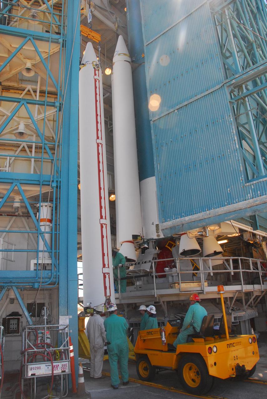 VANDENBERG AIR FORCE BASE, Calif. -- At Space Launch Complex-2 at Vandenberg Air Force Base in California, a crane lifts a solid rocket motor for attachment to the United Launch Alliance Delta II rocket. The Delta II will carry NASA’s National Polar-orbiting Operational Environmental Satellite System Preparatory Project (NPP) satellite into space. NPP represents a critical first step in building the next-generation of Earth-observing satellites. NPP will carry the first of the new sensors developed for this satellite fleet, now known as the Joint Polar Satellite System (JPSS) to be launched in 2016. NPP is the bridge between NASA's Earth Observing System (EOS) satellites and the forthcoming series of JPSS satellites. The mission will test key technologies and instruments for the JPSS missions. NPP is targeted to launch Oct. 25. For more information, visit http://www.nasa.gov/NPP. Photo credit: NASA/VAFB, Mark Mackley