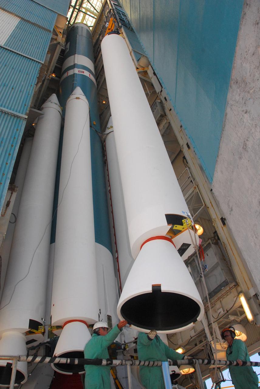 VANDENBERG AIR FORCE BASE, Calif. -- At Space Launch Complex-2 at Vandenberg Air Force Base in California, technicians check the position as a crane moves a solid rocket motor closer to the United Launch Alliance Delta II rocket. The Delta II will carry NASA’s National Polar-orbiting Operational Environmental Satellite System Preparatory Project (NPP) satellite into space. NPP represents a critical first step in building the next-generation of Earth-observing satellites. NPP will carry the first of the new sensors developed for this satellite fleet, now known as the Joint Polar Satellite System (JPSS) to be launched in 2016. NPP is the bridge between NASA's Earth Observing System (EOS) satellites and the forthcoming series of JPSS satellites. The mission will test key technologies and instruments for the JPSS missions. NPP is targeted to launch Oct. 25. For more information, visit http://www.nasa.gov/NPP. Photo credit: NASA/VAFB, Mark Mackley