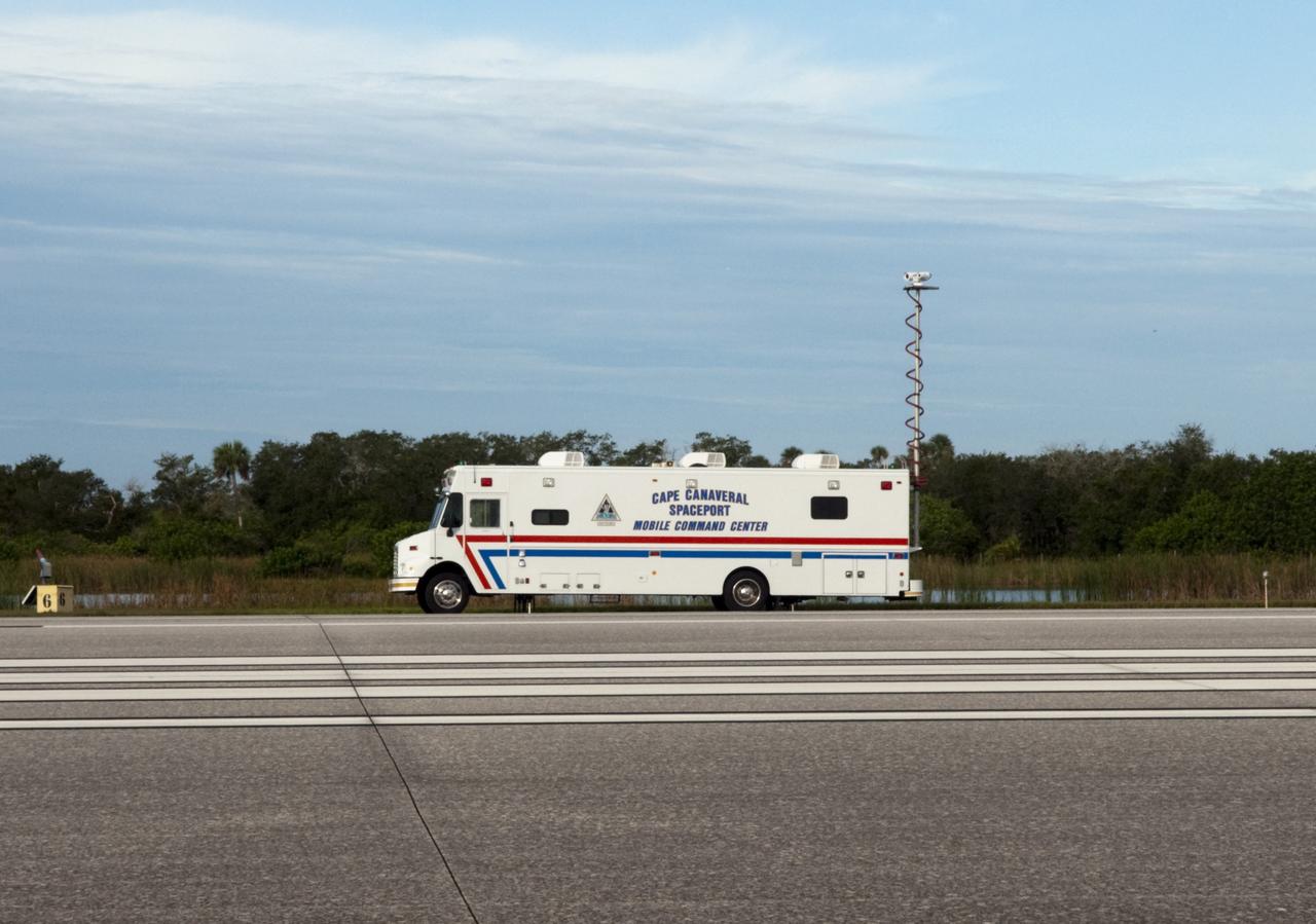 CAPE CANAVERAL, Fla. -- The Cape Canaveral Spaceport Mobile Command Center vehicle participates in the aviation safety exercise during Emergency Response Safety Training at the Shuttle Landing Facility, Runway 33, at NASA’s Kennedy Space Center in Florida.    The simulated helicopter mishap exercise was conducted to evaluate emergency response and mishap investigations of aircraft at Kennedy. Participants included Air Rescue Fire Fighters, Flight Operations, Disaster Preparedness, Security, and Safety. NASA mandates simulated aviation safety training take place every two years. Photo credit: NASA/Kim Shiflett