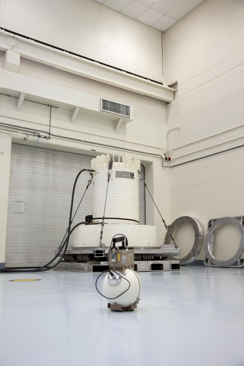 CAPE CANAVERAL, Fla. -- In the high bay of the RTG storage facility at NASA's Kennedy Space Center in Florida, measurements are taken to determine the level of radioactivity emitted from the multi-mission radioisotope thermoelectric generator (MMRTG) for NASA's Mars Science Laboratory mission, enclosed in a shipping cask in the background. The MMRTG will generate the power needed for the mission from the natural decay of plutonium-238, a non-weapons-grade form of the radioisotope. Heat given off by this natural decay will provide constant power through the day and night during all seasons. Waste heat from the MMRTG will be circulated throughout the rover system to keep instruments, computers, mechanical devices and communications systems within their operating temperature ranges. MSL's components include a compact car-sized rover, Curiosity, which has 10 science instruments designed to search for evidence on whether Mars has had environments favorable to microbial life, including chemical ingredients for life. The unique rover will use a laser to look inside rocks and release its gasses so that the rover’s spectrometer can analyze and send the data back to Earth. Launch of MSL aboard a United Launch Alliance Atlas V rocket is scheduled for Nov. 25 from Space Launch Complex 41 on Cape Canaveral Air Force Station in Florida. For more information, visit http://www.nasa.gov/msl. Photo credit: NASA/Frankie Martin