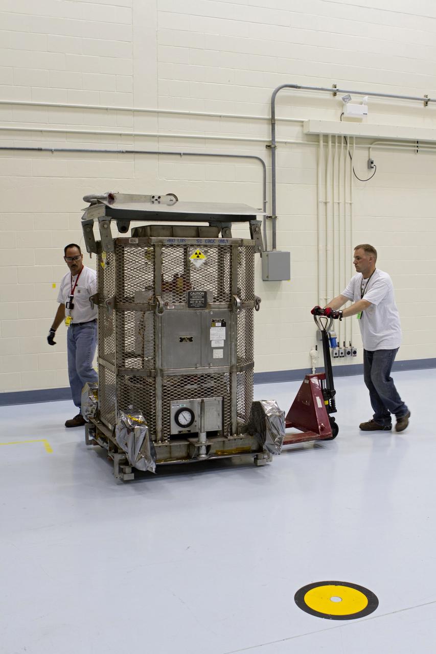 CAPE CANAVERAL, Fla. -- In the high bay of the RTG storage facility at NASA's Kennedy Space Center in Florida, the multi-mission radioisotope thermoelectric generator (MMRTG) for NASA's Mars Science Laboratory (MSL) mission is enclosed in a protective mesh container, known as the "gorilla cage," for transport to the Payload Hazardous Servicing Facility (PHSF). The cage protects the MMRTG and allows any excess heat generated to dissipate into the air.  In the PHSF, the MMRTG temporarily will be installed on the MSL rover, Curiosity, for a fit check but will be installed on the rover for launch at the pad.     The MMRTG will generate the power needed for the mission from the natural decay of plutonium-238, a non-weapons-grade form of the radioisotope. Heat given off by this natural decay will provide constant power through the day and night during all seasons. Curiosity, MSL's car-sized rover, has 10 science instruments designed to search for signs of life, including methane, and help determine if the gas is from a biological or geological source. Waste heat from the MMRTG will be circulated throughout the rover system to keep instruments, computers, mechanical devices and communications systems within their operating temperature ranges. Launch of MSL aboard a United Launch Alliance Atlas V rocket is planned for Nov. 25 from Space Launch Complex 41 on Cape Canaveral Air Force Station. For more information, visit http://www.nasa.gov/msl. Photo credit: NASA/Cory Huston