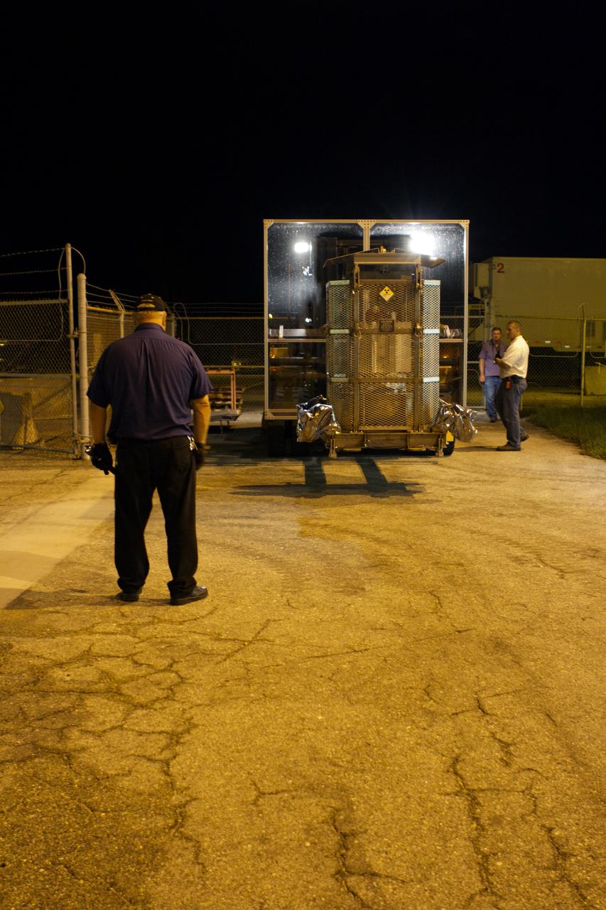 CAPE CANAVERAL, Fla. -- Outside the RTG storage facility at NASA's Kennedy Space Center in Florida, a plexiglass shield has been installed on the forklift enlisted to move the protective mesh container, known as the "gorilla cage," enclosing the multi-mission radioisotope thermoelectric generator (MMRTG) for NASA's Mars Science Laboratory (MSL) mission. The shield minimizes the amount of debris dispersed by the wheels of the forklift that can contact the gorilla cage. The cage protects the MMRTG and allows any excess heat generated to dissipate into the air. The MMRTG is being moved to the Payload Hazardous Servicing Facility (PHSF) where it temporarily will be installed on the MSL rover, Curiosity, for a fit check but will be installed on the rover for launch at the pad. The MMRTG will generate the power needed for the mission from the natural decay of plutonium-238, a non-weapons-grade form of the radioisotope. Heat given off by this natural decay will provide constant power through the day and night during all seasons. Curiosity, MSL's car-sized rover, has 10 science instruments designed to search for signs of life, including methane, and help determine if the gas is from a biological or geological source. Waste heat from the MMRTG will be circulated throughout the rover system to keep instruments, computers, mechanical devices and communications systems within their operating temperature ranges. Launch of MSL aboard a United Launch Alliance Atlas V rocket is planned for Nov. 25 from Space Launch Complex 41 on Cape Canaveral Air Force Station. For more information, visit http://www.nasa.gov/msl. Photo credit: NASA/Cory Huston