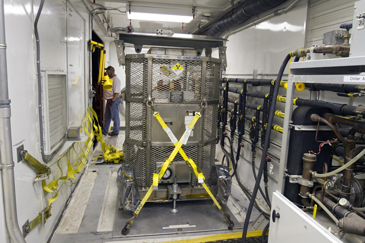 CAPE CANAVERAL, Fla. -- Outside the RTG storage facility at NASA's Kennedy Space Center in Florida, the multi-mission radioisotope thermoelectric generator (MMRTG) for NASA's Mars Science Laboratory (MSL) mission, enclosed in the protective mesh container known as the "gorilla cage," is strapped down inside the MMRTG trailer and ready for transport to the Payload Hazardous Servicing Facility (PHSF). The cage protects the MMRTG and allows any excess heat generated to dissipate into the air. In the PHSF, the MMRTG temporarily will be installed on the MSL rover, Curiosity, for a fit check but will be installed on the rover for launch at the pad. The MMRTG will generate the power needed for the mission from the natural decay of plutonium-238, a non-weapons-grade form of the radioisotope. Heat given off by this natural decay will provide constant power through the day and night during all seasons. Curiosity, MSL's car-sized rover, has 10 science instruments designed to search for signs of life, including methane, and help determine if the gas is from a biological or geological source. Waste heat from the MMRTG will be circulated throughout the rover system to keep instruments, computers, mechanical devices and communications systems within their operating temperature ranges. Launch of MSL aboard a United Launch Alliance Atlas V rocket is planned for Nov. 25 from Space Launch Complex 41 on Cape Canaveral Air Force Station. For more information, visit http://www.nasa.gov/msl. Photo credit: NASA/Cory Huston