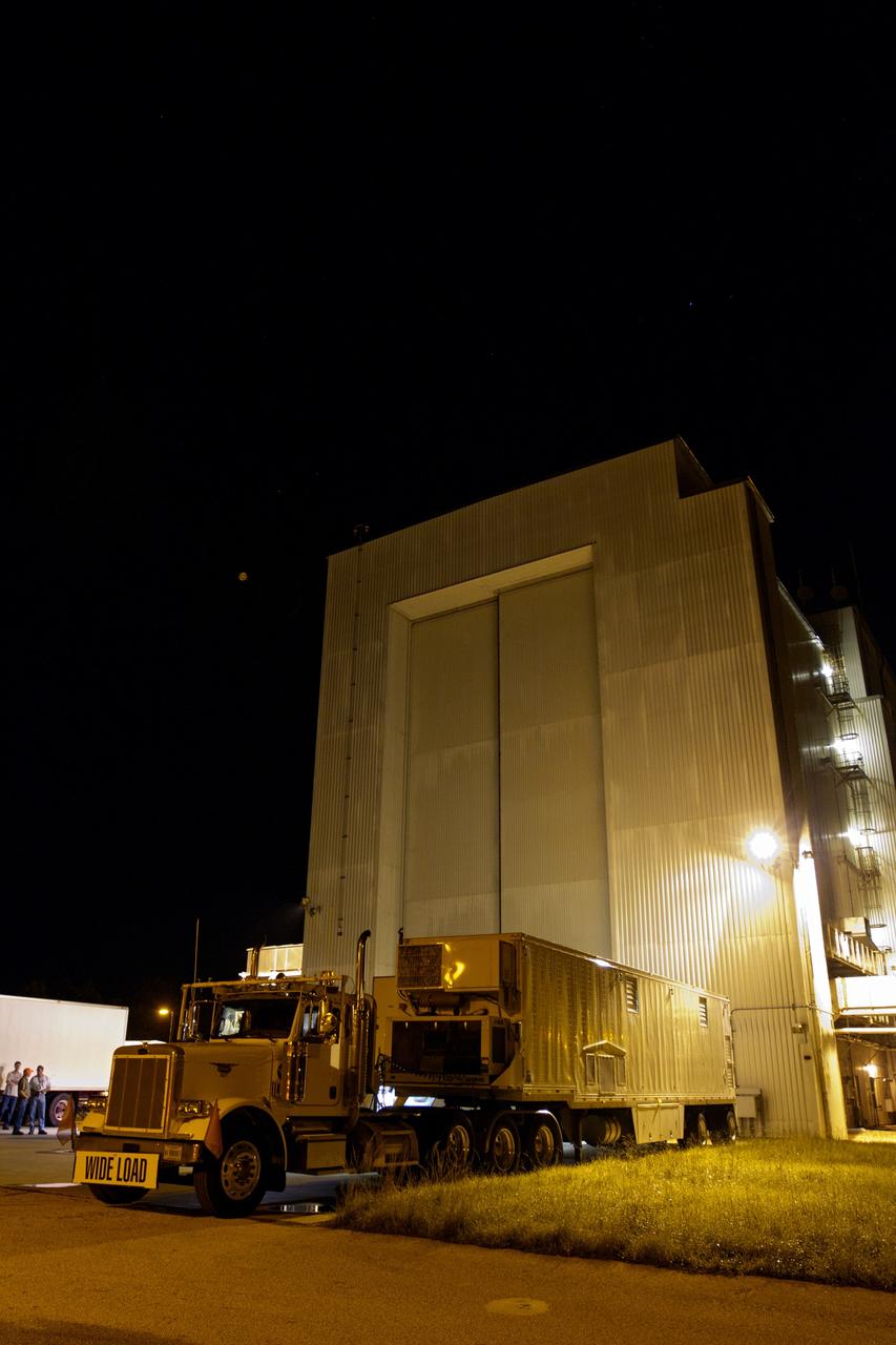 CAPE CANAVERAL, Fla. -- The multi-mission radioisotope thermoelectric generator (MMRTG) for NASA's Mars Science Laboratory (MSL) mission is delivered to the airlock doors of the Payload Hazardous Servicing Facility (PHSF) at NASA's Kennedy Space Center in Florida inside the MMRTG trailer.  In the PHSF, the MMRTG temporarily will be installed on the MSL rover, Curiosity, for a fit check but will be installed on the rover for launch at the pad.    The MMRTG will generate the power needed for the mission from the natural decay of plutonium-238, a non-weapons-grade form of the radioisotope. Heat given off by this natural decay will provide constant power through the day and night during all seasons. Curiosity, MSL's car-sized rover, has 10 science instruments designed to search for signs of life, including methane, and help determine if the gas is from a biological or geological source. Waste heat from the MMRTG will be circulated throughout the rover system to keep instruments, computers, mechanical devices and communications systems within their operating temperature ranges. Launch of MSL aboard a United Launch Alliance Atlas V rocket is planned for Nov. 25 from Space Launch Complex 41 on Cape Canaveral Air Force Station. For more information, visit http://www.nasa.gov/msl. Photo credit: NASA/Cory Huston