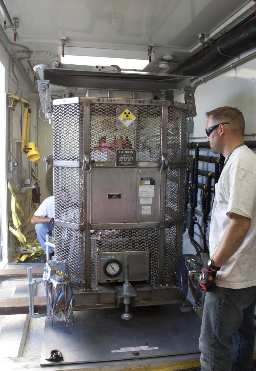 CAPE CANAVERAL, Fla. -- At NASA's Kennedy Space Center in Florida, preparations are under way to secure the multi-mission radioisotope thermoelectric generator (MMRTG) for NASA's Mars Science Laboratory (MSL) mission in the MMRTG trailer.  The MMRTG is enclosed in a mesh container, known as the "gorilla cage," which protects it during transport and allows any excess heat generated to dissipate into the air.  The MMRTG is being moved to the RTG storage facility following a fit check on MSL's Curiosity rover in the Payload Hazardous Servicing Facility (PHSF).    The MMRTG will generate the power needed for the mission from the natural decay of plutonium-238, a non-weapons-grade form of the radioisotope. Heat given off by this natural decay will provide constant power through the day and night during all seasons. MSL's components include a compact car-sized rover, Curiosity, which has 10 science instruments designed to search for signs of life, including methane, and help determine if the gas is from a biological or geological source. Waste heat from the MMRTG will be circulated throughout the rover system to keep instruments, computers, mechanical devices and communications systems within their operating temperature ranges. Launch of MSL aboard a United Launch Alliance Atlas V rocket is targeted for Nov. 25 from Space Launch Complex 41 on Cape Canaveral Air Force Station. For more information, visit http://www.nasa.gov/msl. Photo credit: NASA/Troy Cryder