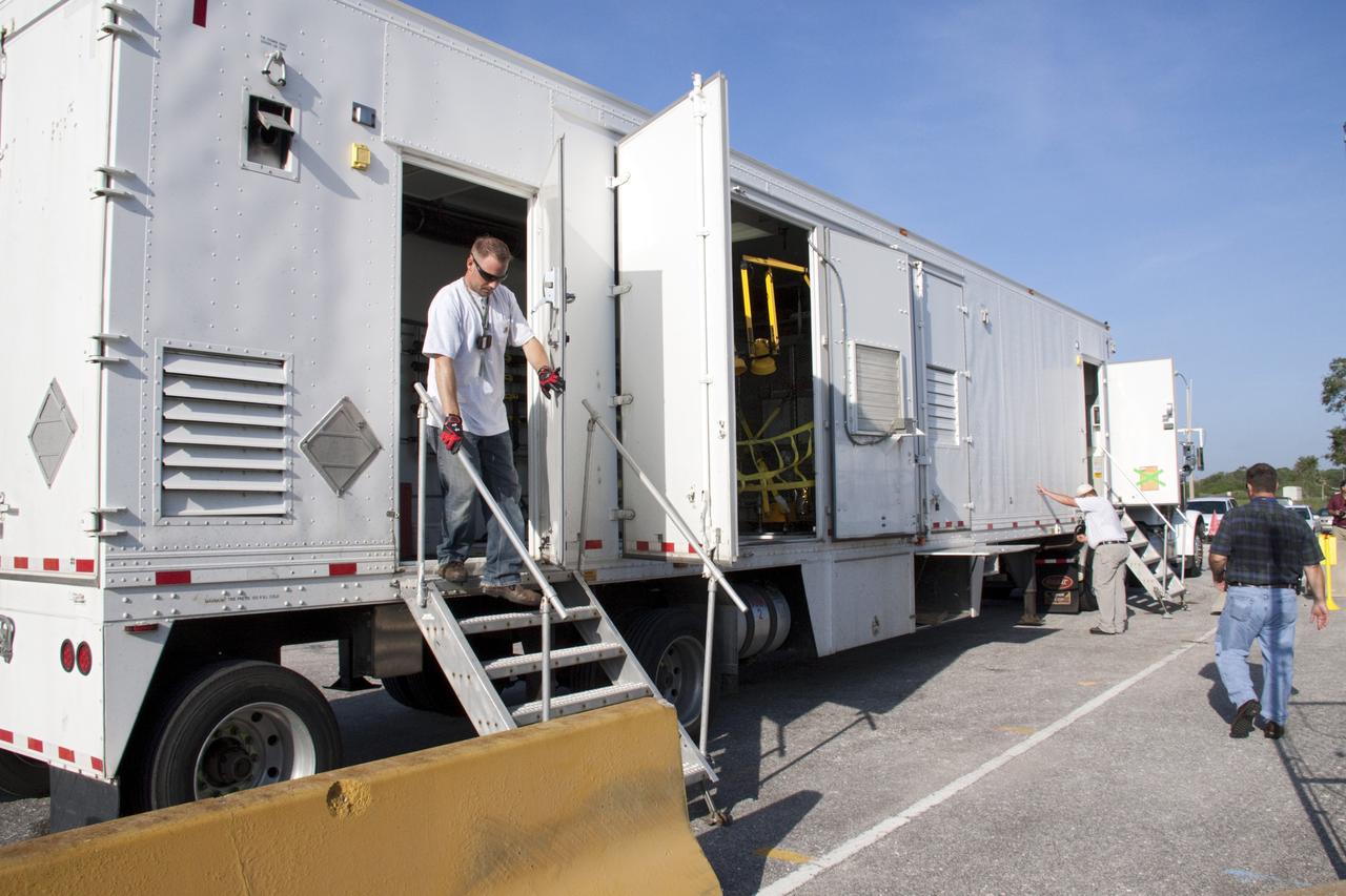 CAPE CANAVERAL, Fla. -- At the RTG storage facility (RTGF) at NASA's Kennedy Space Center in Florida, preparations are under way to offload the multi-mission radioisotope thermoelectric generator (MMRTG) for NASA's Mars Science Laboratory (MSL) mission from the MMRTG trailer. The MMRTG is returning to the RTGF following a fit check on MSL's Curiosity rover in the Payload Hazardous Servicing Facility (PHSF).    The MMRTG will generate the power needed for the mission from the natural decay of plutonium-238, a non-weapons-grade form of the radioisotope. Heat given off by this natural decay will provide constant power through the day and night during all seasons. MSL's components include a compact car-sized rover, Curiosity, which has 10 science instruments designed to search for signs of life, including methane, and help determine if the gas is from a biological or geological source. Waste heat from the MMRTG will be circulated throughout the rover system to keep instruments, computers, mechanical devices and communications systems within their operating temperature ranges. Launch of MSL aboard a United Launch Alliance Atlas V rocket is targeted for Nov. 25 from Space Launch Complex 41 on Cape Canaveral Air Force Station. For more information, visit http://www.nasa.gov/msl. Photo credit: NASA/Troy Cryder