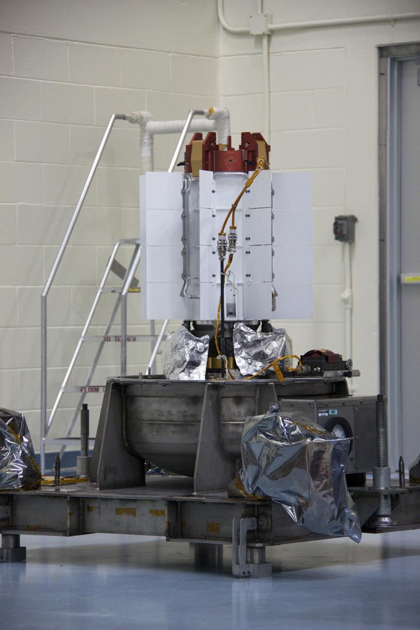 CAPE CANAVERAL, Fla. -- The multi-mission radioisotope thermoelectric generator (MMRTG) for NASA's Mars Science Laboratory (MSL) mission is uncovered in the high bay of the RTG storage facility (RTGF) at NASA's Kennedy Space Center in Florida.  The MMRTG was returned to the RTGF following a fit check on MSL's Curiosity rover in the Payload Hazardous Servicing Facility (PHSF).    The MMRTG will generate the power needed for the mission from the natural decay of plutonium-238, a non-weapons-grade form of the radioisotope. Heat given off by this natural decay will provide constant power through the day and night during all seasons. MSL's components include a compact car-sized rover, Curiosity, which has 10 science instruments designed to search for signs of life, including methane, and help determine if the gas is from a biological or geological source. Waste heat from the MMRTG will be circulated throughout the rover system to keep instruments, computers, mechanical devices and communications systems within their operating temperature ranges. Launch of MSL aboard a United Launch Alliance Atlas V rocket is targeted for Nov. 25 from Space Launch Complex 41 on Cape Canaveral Air Force Station. For more information, visit http://www.nasa.gov/msl. Photo credit: NASA/Troy Cryder