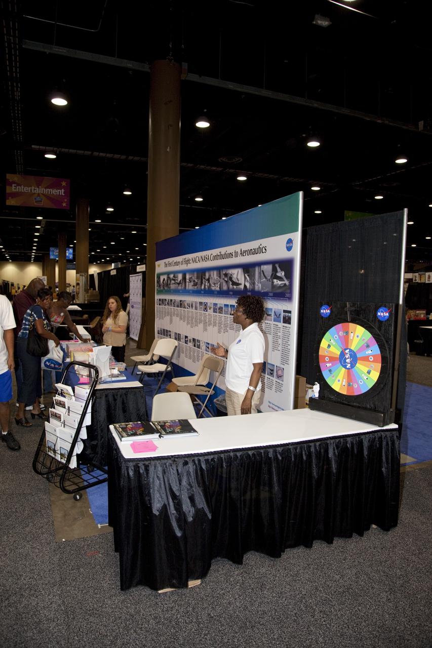 CAPE CANAVERAL, Fla. -- Education specialists from several NASA centers discuss the accomplishments of the agency with the nationwide attendees of the Tom Joyner Family Reunion. The event was held in the Exhibit Hall of the Gaylord Palms Resort and Convention Center in Kissimmee, Fla., and hosted by nationally syndicated radio personality Tom Joyner during the extended Labor Day weekend Sept. 1-4. Besides offering attendees the opportunity to visit tourist attractions in the Orlando area, the reunion gave NASA an avenue to tout the benefits of math and scientific learning, as well as the many educational opportunities offered by the space agency. For more information on NASA's education initiatives, visit http://www.nasa.gov/education. Photo credit: NASA/Frankie Martin