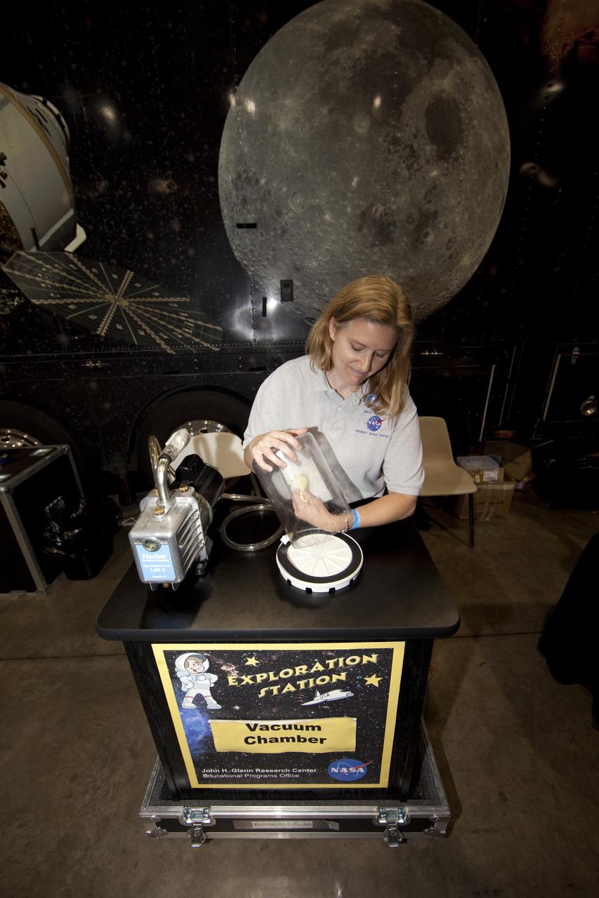 CAPE CANAVERAL, Fla. -- An education specialist from Kennedy Space Center prepares to demonstrate the principles of a vacuum chamber to the nationwide attendees of the Tom Joyner Family Reunion. The demonstration was held in front of NASA’s Journey to Tomorrow trailer at reunion headquarters at the Gaylord Palms Resort and Convention Center in Kissimmee, Fla. The reunion was hosted by nationally syndicated radio personality Tom Joyner during the extended Labor Day weekend Sept. 1-4. Besides offering attendees the opportunity to visit tourist attractions in the Orlando area, the reunion gave NASA an avenue to tout the benefits of math and scientific learning, as well as the many educational opportunities offered by the space agency. For more information on NASA's education initiatives, visit http://www.nasa.gov/education. Photo credit: NASA/Frankie Martin