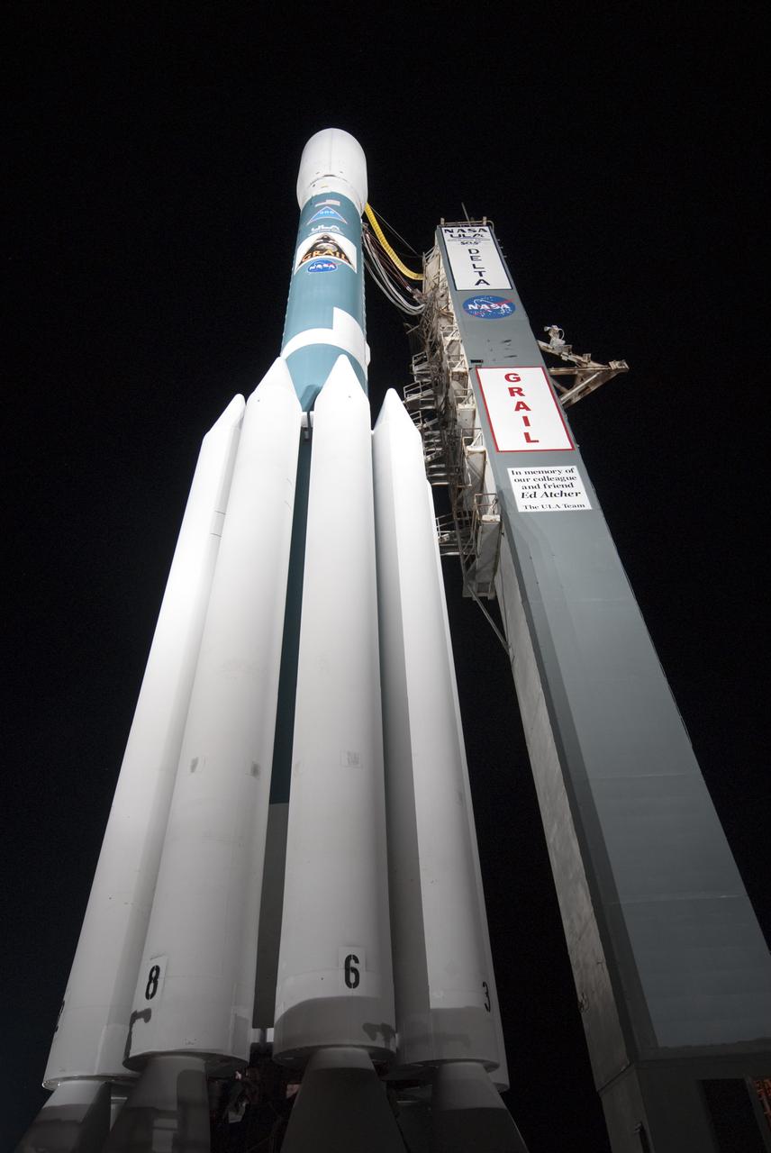 CAPE CANAVERAL, Fla. -- At Space Launch Complex 17B on Cape Canaveral Air Force Station, the United Launch Alliance Delta II rocket that will launch NASA's Gravity Recovery and Interior Laboratory mission towers over the pad.  The mobile service tower has been rolled away from the vehicle for launch.  The "rollback" began at about 11:20 p.m. EDT Sept. 7.    GRAIL will fly twin spacecraft in tandem around the moon to precisely measure and map variations in the moon's gravitational field. The mission will provide the most accurate global gravity field to date for any planet, including Earth. This detailed information will reveal differences in the density of the moon's crust and mantle and will help answer fundamental questions about the moon's internal structure, thermal evolution, and history of collisions with asteroids. The aim is to map the moon's gravity field so completely that future lunar vehicles can safely navigate anywhere on the moon’s surface.  Launch is scheduled for 8:37:06 a.m. EDT Sept. 8.  For more information, visit http://www.nasa.gov/grail. Photo credit: NASA/Kim Shiflett