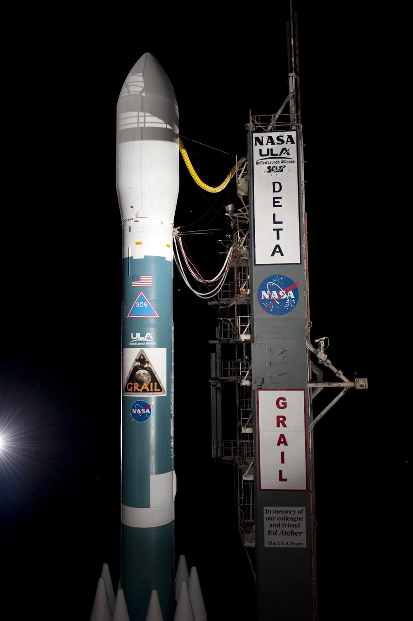 CAPE CANAVERAL, Fla. -- At Space Launch Complex 17B on Cape Canaveral Air Force Station, view of the United Launch Alliance Delta II rocket that will launch NASA's Gravity Recovery and Interior Laboratory mission is unobstructed as the mobile service tower rolls away.  The "rollback" began at about 11:20 p.m. EDT.    GRAIL will fly twin spacecraft in tandem around the moon to precisely measure and map variations in the moon's gravitational field. The mission will provide the most accurate global gravity field to date for any planet, including Earth. This detailed information will reveal differences in the density of the moon's crust and mantle and will help answer fundamental questions about the moon's internal structure, thermal evolution, and history of collisions with asteroids. The aim is to map the moon's gravity field so completely that future lunar vehicles can safely navigate anywhere on the moon’s surface.  Launch is scheduled for 8:37:06 a.m. EDT Sept. 8.  For more information, visit http://www.nasa.gov/grail. Photo credit: NASA/Kim Shiflett
