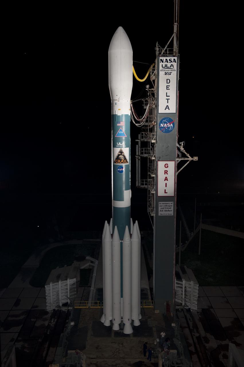 CAPE CANAVERAL, Fla. -- At Space Launch Complex 17B on Cape Canaveral Air Force Station, the United Launch Alliance Delta II rocket that will launch NASA's Gravity Recovery and Interior Laboratory mission is revealed as the mobile service tower rolls away.  The "rollback" began at about 11:20 p.m. EDT.    GRAIL will fly twin spacecraft in tandem around the moon to precisely measure and map variations in the moon's gravitational field. The mission will provide the most accurate global gravity field to date for any planet, including Earth. This detailed information will reveal differences in the density of the moon's crust and mantle and will help answer fundamental questions about the moon's internal structure, thermal evolution, and history of collisions with asteroids. The aim is to map the moon's gravity field so completely that future lunar vehicles can safely navigate anywhere on the moon’s surface.  Launch is scheduled for 8:37:06 a.m. EDT Sept. 8.  For more information, visit http://www.nasa.gov/grail. Photo credit: NASA/Kim Shiflett