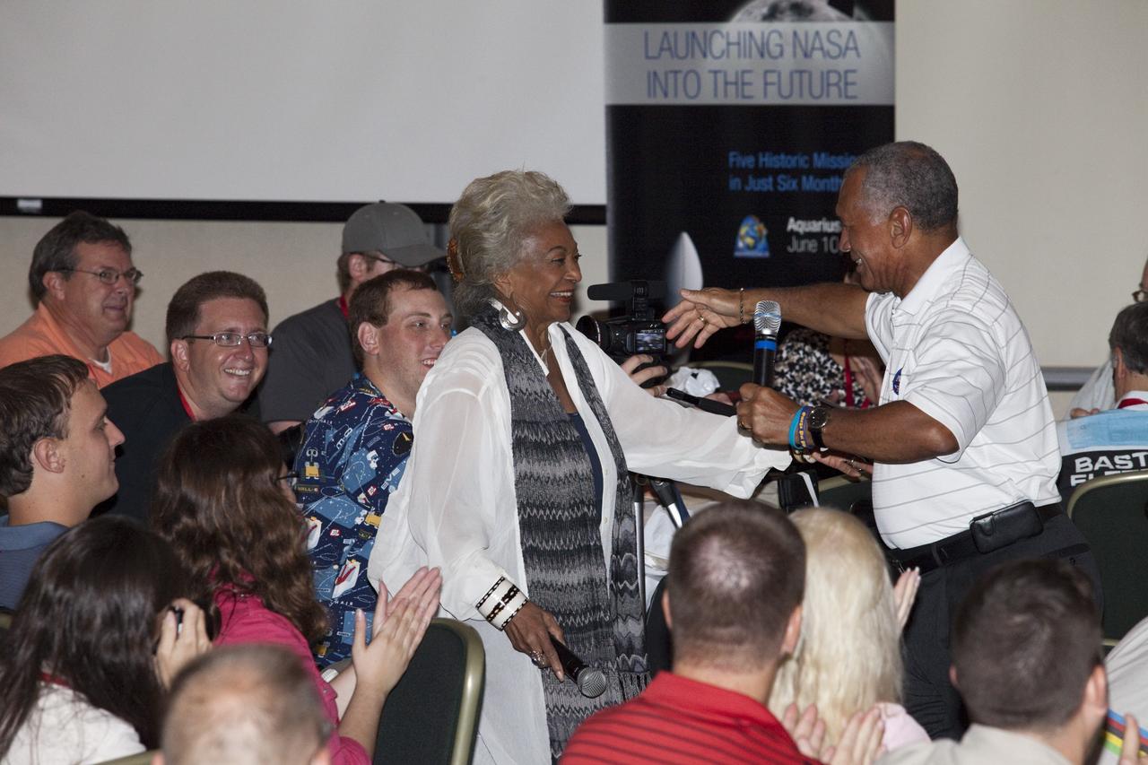CAPE CANAVERAL, Fla. – NASA Administrator Charlie Bolden welcomes actress Nichelle Nichols (Lt. Uhura on Star Trek) to a Tweetup presentation at the Kennedy Space Center Visitor Complex in Florida during prelaunch activities for the agency’s Gravity Recovery and Interior Laboratory (GRAIL) mission. Participants toured NASA’s Kennedy Space Center and got a close-up view of Space Launch Complex 17B at Cape Canaveral Air Force Station. The tweeters will share their experiences with followers through the social networking site Twitter. GRAIL will fly twin spacecraft in tandem around the moon to precisely measure and map variations in the moon’s gravitational field. The mission will provide the most accurate global gravity field to date for any planet, including Earth. This detailed information will reveal differences in the density of the moon’s crust and mantle and will help answer fundamental questions about the moon’s internal structure, thermal evolution, and history of collisions with asteroids. The aim is to map the moon’s gravity field so completely that future lunar vehicles can safely navigate anywhere on the moon’s surface. Launch is scheduled for 8:37:06 a.m. EDT Sept. 8. For more information, visit http://www.nasa.gov/grail. Photo credit: NASA/Gianni Woods