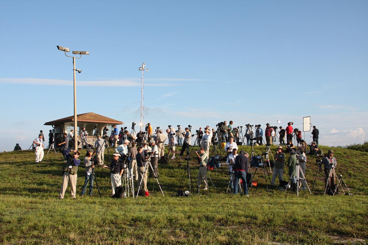 CAPE CANAVERAL, Fla. -- Media representatives check the lighting at Press Site 1 near Space Launch Complex 17B on Cape Canaveral Air Force Station during preparations to photograph the launch of NASA's Gravity Recovery and Interior Laboratory mission. Liftoff aboard a United Launch Alliance Delta II Heavy rocket is scheduled for 8:37:06 a.m. EDT. GRAIL will fly twin spacecraft in tandem around the moon to precisely measure and map variations in the moon's gravitational field. The mission will provide the most accurate global gravity field to date for any planet, including Earth. This detailed information will reveal differences in the density of the moon's crust and mantle and will help answer fundamental questions about the moon's internal structure, thermal evolution, and history of collisions with asteroids. The aim is to map the moon's gravity field so completely that future lunar vehicles can safely navigate anywhere on the moon’s surface. For more information, visit http://www.nasa.gov/grail. Photo credit: NASA/Ken Thornsley