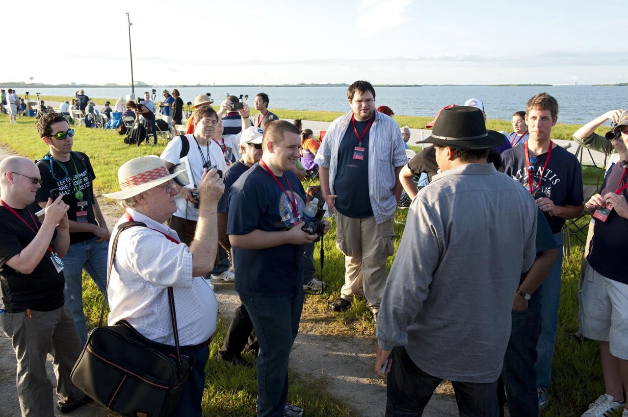 CAPE CANAVERAL, Fla. – Astrophysicist Dr. Neil deGrasse Tyson with the American Museum of Natural History’s Hayden Planetarium in New York, speaks to a group of Tweetup participants at NASA Kennedy Space Center’s NASA Causeway launch viewing site in Florida during prelaunch activities for the agency’s Gravity Recovery and Interior Laboratory (GRAIL) mission. Participants toured the center and got a close-up view of Space Launch Complex 17B at Cape Canaveral Air Force Station. The tweeters will share their experiences with followers through the social networking site Twitter.    GRAIL will fly twin spacecraft in tandem around the moon to precisely measure and map variations in the moon’s gravitational field. The mission will provide the most accurate global gravity field to date for any planet, including Earth. This detailed information will reveal differences in the density of the moon’s crust and mantle and will help answer fundamental questions about the moon’s internal structure, thermal evolution, and history of collisions with asteroids. The aim is to map the moon’s gravity field so completely that future lunar vehicles can safely navigate anywhere on the moon’s surface. Launch is scheduled for 8:37:06 a.m. EDT Sept. 8. For more information, visit http://www.nasa.gov/grail. Photo credit: NASA/Kim Shiflett