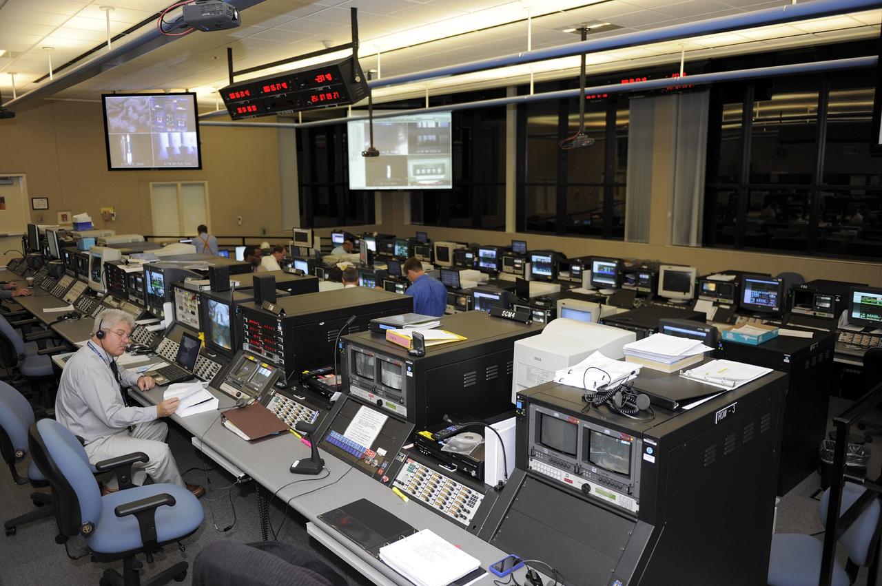 CAPE CANAVERAL, Fla. -- On Cape Canaveral Air Force Station in Florida, United Launch Alliance (ULA) personnel in the Delta Operations Building prepare for the launch of NASA's Gravity Recovery and Interior Laboratory mission aboard a ULA Delta II Heavy rocket. Physical control of the rocket is maintained from the building, located about a mile from Space Launch Complex 17B. The room functions as a "soft blockhouse" and is the room from which the computer-generated command to launch the rocket is issued two seconds before liftoff. Launch is scheduled for 8:37:06 a.m. EDT Sept. 8. GRAIL will fly twin spacecraft in tandem around the moon to precisely measure and map variations in the moon's gravitational field. The mission will provide the most accurate global gravity field to date for any planet, including Earth. For more information, visit http://www.nasa.gov/grail. Photo credit: NASA/Kim Shiflett