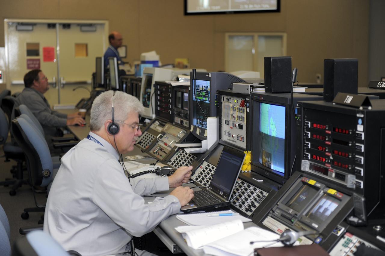CAPE CANAVERAL, Fla. -- On Cape Canaveral Air Force Station in Florida, United Launch Alliance (ULA) personnel in the Delta Operations Building prepare for the launch of NASA's Gravity Recovery and Interior Laboratory mission aboard a ULA Delta II Heavy rocket. Physical control of the rocket is maintained from the building, located about a mile from Space Launch Complex 17B. The room functions as a "soft blockhouse" and is the room from which the computer-generated command to launch the rocket is issued two seconds before liftoff. Launch is scheduled for 8:37:06 a.m. EDT Sept. 8. GRAIL will fly twin spacecraft in tandem around the moon to precisely measure and map variations in the moon's gravitational field. The mission will provide the most accurate global gravity field to date for any planet, including Earth. For more information, visit http://www.nasa.gov/grail. Photo credit: NASA/Kim Shiflett