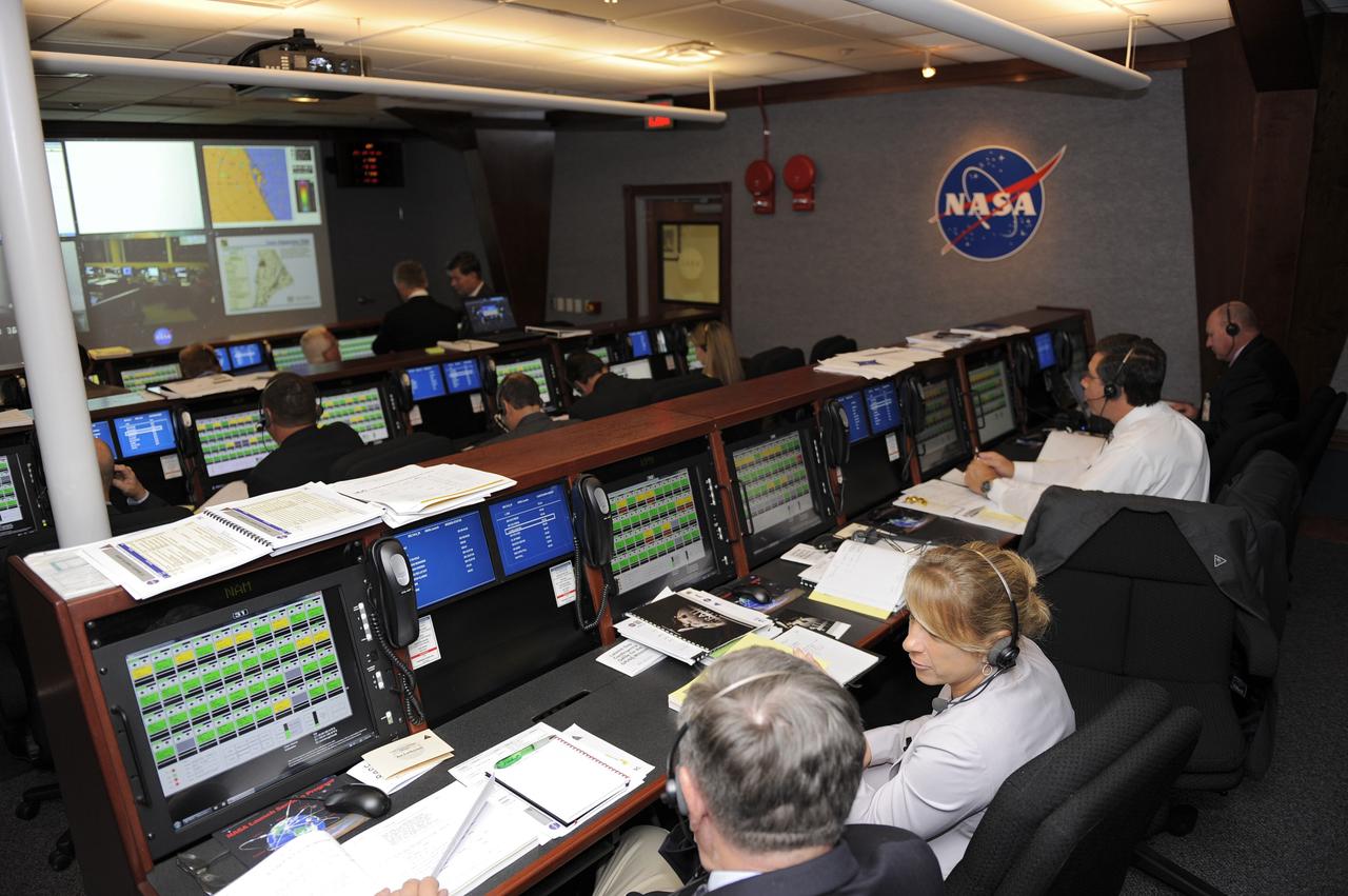 CAPE CANAVERAL, Fla. -- On Cape Canaveral Air Force Station in Florida, members of NASA's Gravity Recovery and Interior Laboratory (GRAIL) launch team monitor GRAIL's launch countdown from the Mission Directors Center in Hangar AE.  From left are Joe Lackovich, NASA advisory manager, NASA's Launch Services Program (LSP); Amanda Mitskevich, manager, LSP; and Oscar Toledo, NASA Headquarters senior advisor, LSP.    Launch is scheduled for 8:37:06 a.m. EDT Sept. 8 from Space Launch Complex 17B on Cape Canaveral Air Force Station.  GRAIL will fly twin spacecraft in tandem around the moon to precisely measure and map variations in the moon's gravitational field. The mission will provide the most accurate global gravity field to date for any planet, including Earth.  For more information, visit http://www.nasa.gov/grail. Photo credit: NASA/Kim Shiflett