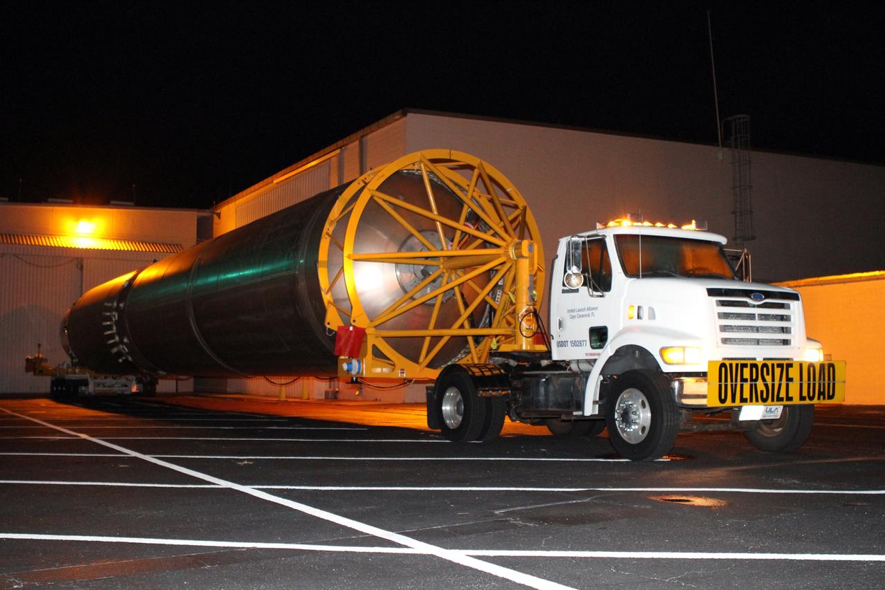 CAPE CANAVERAL, Fla. -- The first stage of the Atlas V rocket for NASA's Mars Science Laboratory (MSL) mission rolls out of the Atlas Spaceflight Operations Center on Cape Canaveral Air Force Station in Florida bound for the launch pad.    A United Launch Alliance Atlas V-541 configuration will be used to loft MSL into space. Curiosity’s 10 science instruments are designed to search for evidence on whether Mars has had environments favorable to microbial life, including chemical ingredients for life.  The unique rover will use a laser to look inside rocks and release its gasses so that the rover’s spectrometer can analyze and send the data back to Earth. MSL is scheduled to launch Nov. 25 with a window extending to Dec. 18 and arrival at Mars Aug. 2012. For more information, visit http://www.nasa.gov/msl. Photo credit: NASA/Cory Huston