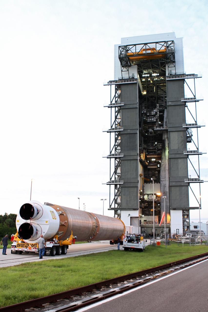 CAPE CANAVERAL, Fla. -- The first stage of the Atlas V rocket for NASA's Mars Science Laboratory (MSL) mission arrives at the Vertical Integration Facility at Space Launch Complex 41 on Cape Canaveral Air Force Station.      A United Launch Alliance Atlas V-541 configuration will be used to loft MSL into space. Curiosity’s 10 science instruments are designed to search for evidence on whether Mars has had environments favorable to microbial life, including chemical ingredients for life.  The unique rover will use a laser to look inside rocks and release its gasses so that the rover’s spectrometer can analyze and send the data back to Earth. MSL is scheduled to launch Nov. 25 with a window extending to Dec. 18 and arrival at Mars Aug. 2012. For more information, visit http://www.nasa.gov/msl. Photo credit: NASA/Cory Huston