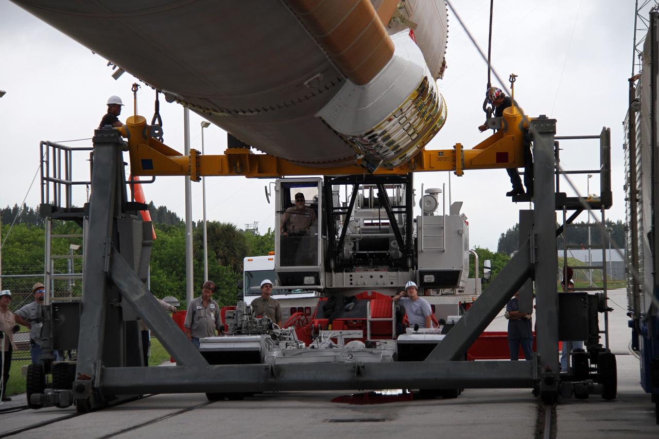 CAPE CANAVERAL, Fla. -- Vigilant workers monitor the first stage of the Atlas V rocket for NASA's Mars Science Laboratory (MSL) mission as it is lifted into the Vertical Integration Facility at Space Launch Complex 41 on Cape Canaveral Air Force Station. A United Launch Alliance Atlas V-541 configuration will be used to loft MSL into space. Curiosity’s 10 science instruments are designed to search for evidence on whether Mars has had environments favorable to microbial life, including chemical ingredients for life. The unique rover will use a laser to look inside rocks and release its gasses so that the rover’s spectrometer can analyze and send the data back to Earth. MSL is scheduled to launch Nov. 25 with a window extending to Dec. 18 and arrival at Mars Aug. 2012. For more information, visit http://www.nasa.gov/msl. Photo credit: NASA/Cory Huston