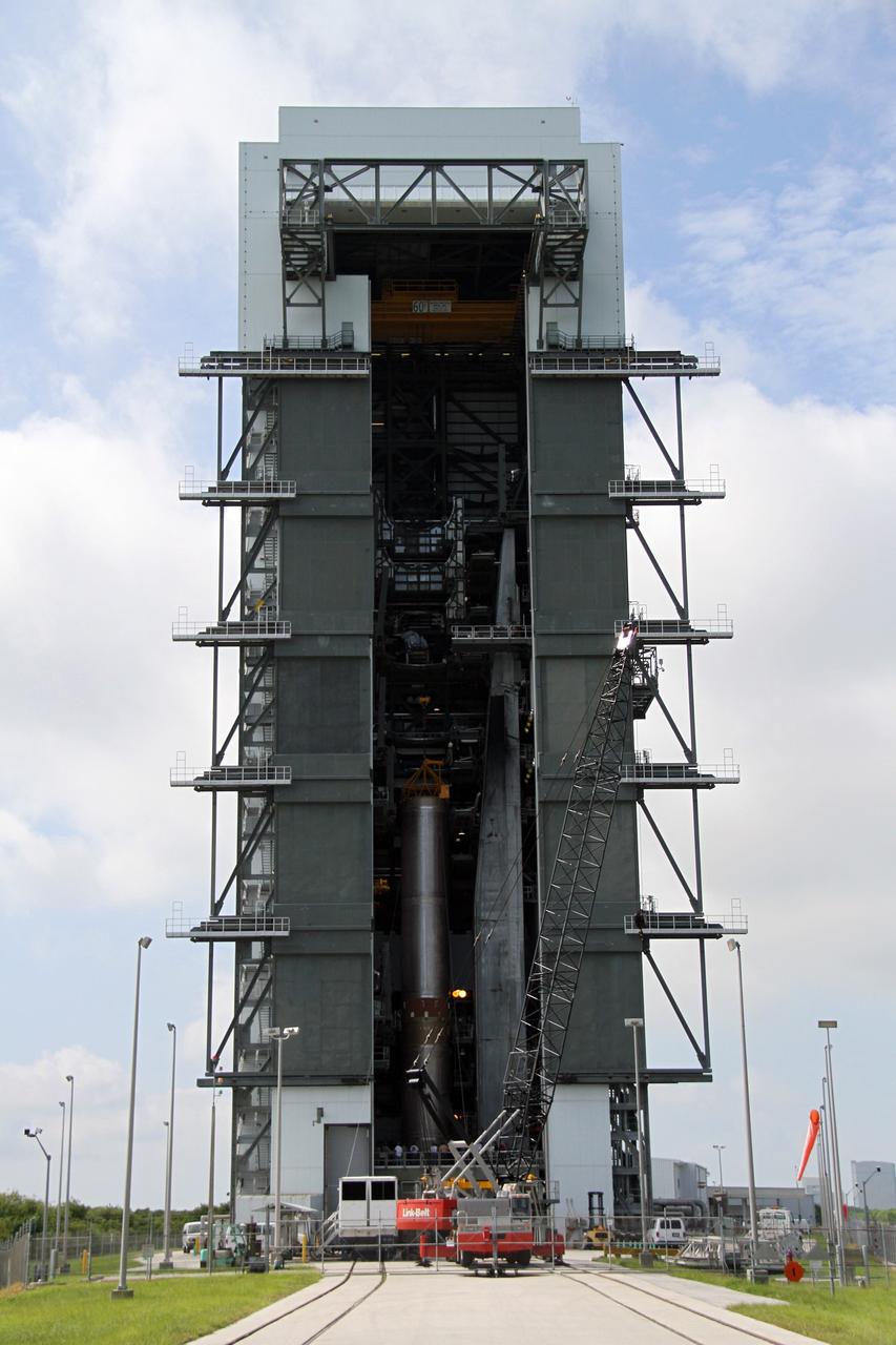 CAPE CANAVERAL, Fla. -- The 106.5-foot-long first stage of the Atlas V rocket for NASA's Mars Science Laboratory (MSL) mission is secured on its launch platform inside the Vertical Integration Facility at Space Launch Complex 41 on Cape Canaveral Air Force Station.    A United Launch Alliance Atlas V-541 configuration will be used to loft MSL into space. Curiosity’s 10 science instruments are designed to search for evidence on whether Mars has had environments favorable to microbial life, including chemical ingredients for life.  The unique rover will use a laser to look inside rocks and release its gasses so that the rover’s spectrometer can analyze and send the data back to Earth. MSL is scheduled to launch Nov. 25 with a window extending to Dec. 18 and arrival at Mars Aug. 2012. For more information, visit http://www.nasa.gov/msl. Photo credit: NASA/Cory Huston