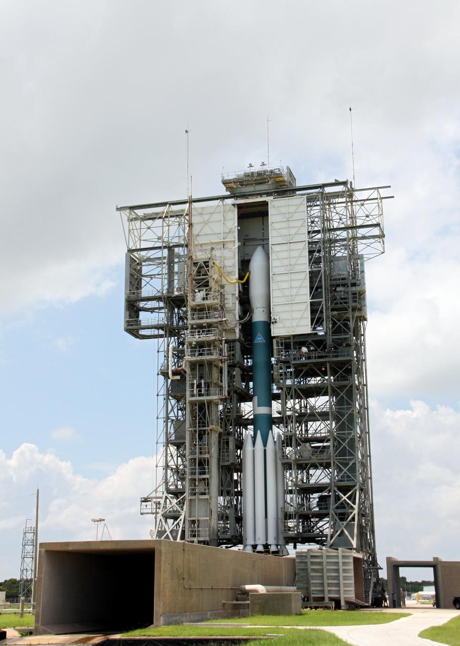 CAPE CANAVERAL, Fla. – At Space Launch Complex 17B on Cape Canaveral Air Force Station, the United Launch Alliance Delta II heavy rocket that will launch NASA's Gravity Recovery and Interior Laboratory spacecraft is rolled back around to the mobile service tower after the first launch attempt was scrubbed due to upper-level winds. GRAIL is scheduled for another launch attempt Sept.10 at 8:29:45 a.m. EDT. GRAIL will fly twin spacecraft in tandem around the moon to precisely measure and map variations in the moon's gravitational field. The mission will provide the most accurate global gravity field to date for any planet, including Earth. This detailed information will reveal differences in the density of the moon's crust and mantle and will help answer fundamental questions about the moon's internal structure, thermal evolution, and history of collisions with asteroids. The aim is to map the moon's gravity field so completely that future moon vehicles can safely navigate anywhere on the moon’s surface. For more information, visit http://www.nasa.gov/grail. Photo credit: NASA/Ken Thornsley