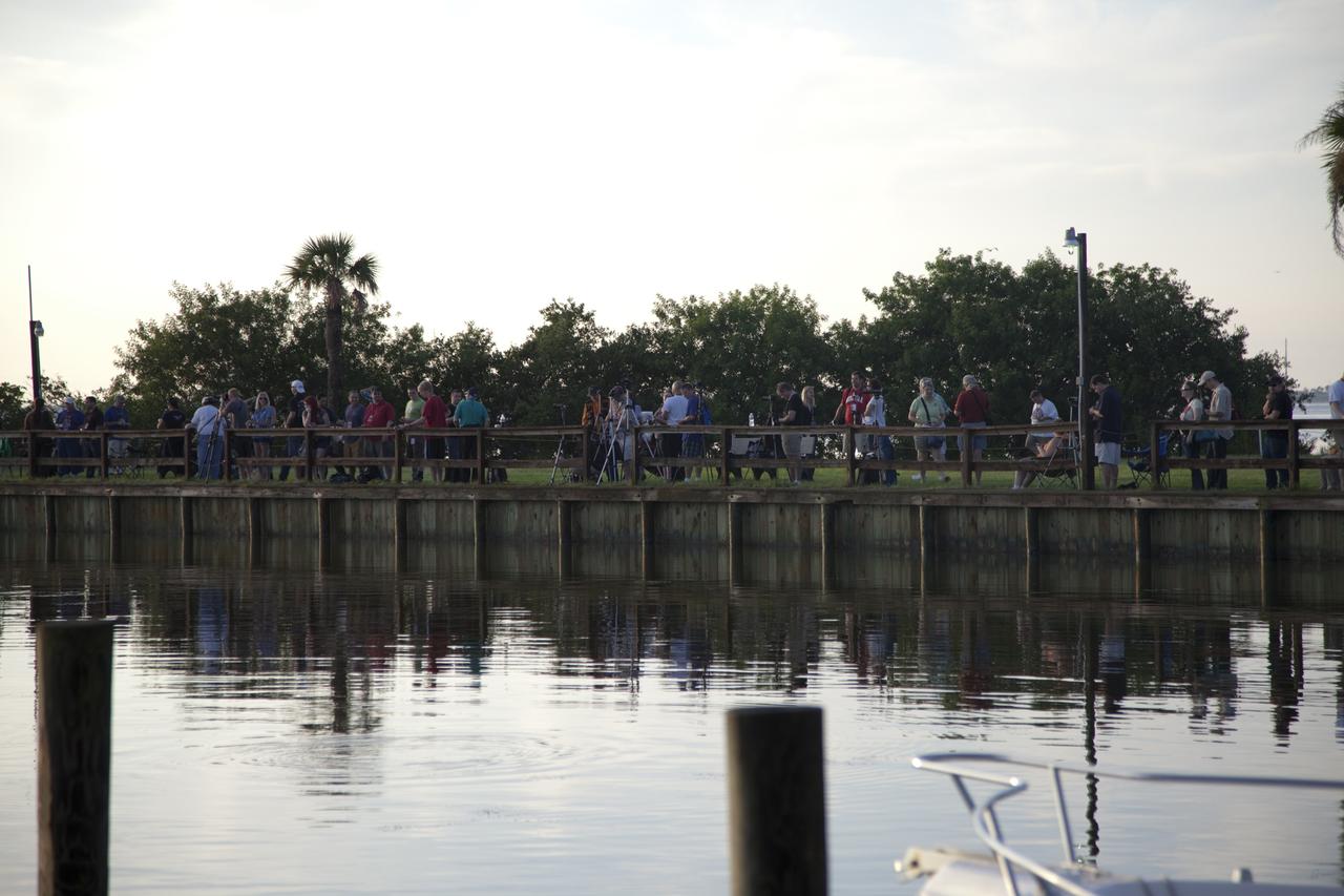 CAPE CANAVERAL, Fla. – At KARS Park 1 on Merritt Island in Florida, a group of Tweetup participants prepare to watch the United Launch Alliance Delta II Heavy rocket launch from Space Launch Complex 17B at Cape Canaveral Air Force Station carrying NASA’s Gravity Recovery and Interior Laboratory (GRAIL) mission to the moon. The tweeters will share their experiences with followers through the social networking site Twitter. GRAIL will fly twin spacecraft in tandem around the moon to precisely measure and map variations in the moon's gravitational field. The mission will provide the most accurate global gravity field to date for any planet, including Earth. This detailed information will reveal differences in the density of the moon's crust and mantle and will help answer fundamental questions about the moon's internal structure, thermal evolution, and history of collisions with asteroids. The aim is to map the moon's gravity field so completely that future moon vehicles can safely navigate anywhere on the moon’s surface. For more information, visit http://www.nasa.gov/grail. Photo credit: NASA/Frankie Martin