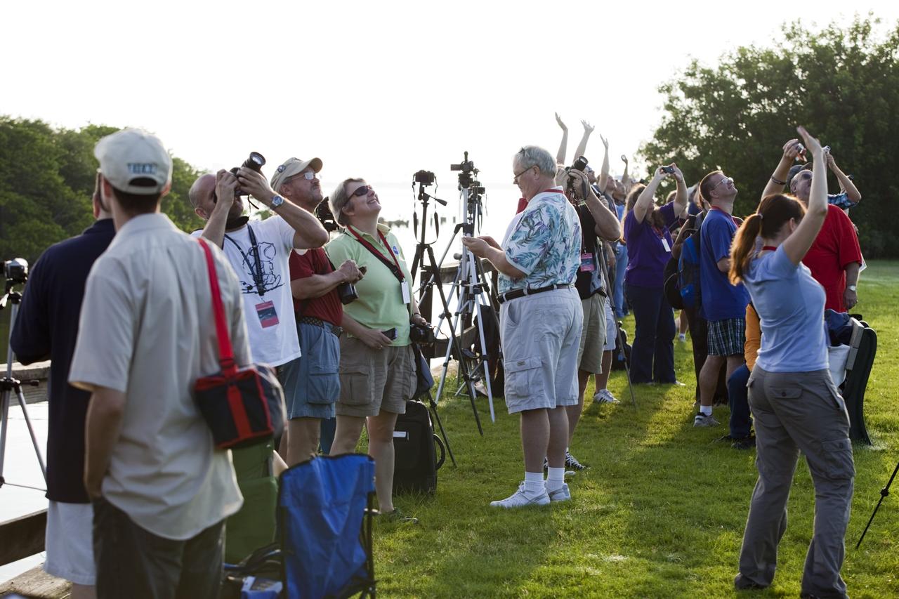 CAPE CANAVERAL, Fla. – At KARS Park 1 on Merritt Island in Florida, a group of Tweetup participants watch as a United Launch Alliance Delta II Heavy rocket lifts off at 9:08 a.m. EDT Sept. 10 from Space Launch Complex 17B at Cape Canaveral Air Force Station carrying NASA’s Gravity Recovery and Interior Laboratory (GRAIL) mission to the moon. The tweeters will share their experiences with followers through the social networking site Twitter. GRAIL will fly twin spacecraft in tandem around the moon to precisely measure and map variations in the moon's gravitational field. The mission will provide the most accurate global gravity field to date for any planet, including Earth. This detailed information will reveal differences in the density of the moon's crust and mantle and will help answer fundamental questions about the moon's internal structure, thermal evolution, and history of collisions with asteroids. The aim is to map the moon's gravity field so completely that future moon vehicles can safely navigate anywhere on the moon’s surface. For more information, visit http://www.nasa.gov/grail. Photo credit: NASA/Frankie Martin
