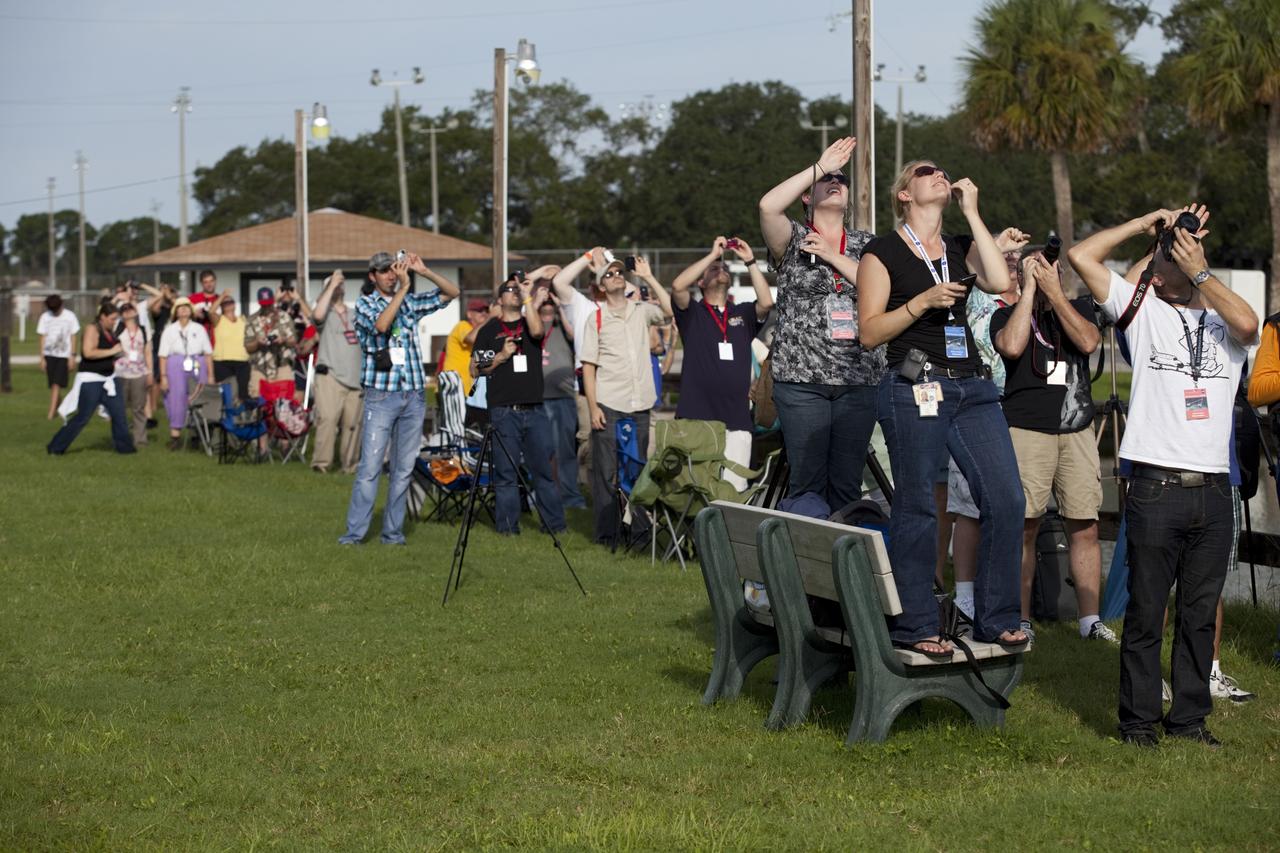 CAPE CANAVERAL, Fla. – At KARS Park 1 on Merritt Island in Florida, a group of Tweetup participants take pictures and watch excitedly as a United Launch Alliance Delta II Heavy rocket lifts off at 9:08 a.m. EDT Sept. 10 from Space Launch Complex 17B at Cape Canaveral Air Force Station carrying NASA’s Gravity Recovery and Interior Laboratory (GRAIL) mission to the moon. The tweeters will share their experiences with followers through the social networking site Twitter. GRAIL will fly twin spacecraft in tandem around the moon to precisely measure and map variations in the moon's gravitational field. The mission will provide the most accurate global gravity field to date for any planet, including Earth. This detailed information will reveal differences in the density of the moon's crust and mantle and will help answer fundamental questions about the moon's internal structure, thermal evolution, and history of collisions with asteroids. The aim is to map the moon's gravity field so completely that future moon vehicles can safely navigate anywhere on the moon’s surface. For more information, visit http://www.nasa.gov/grail. Photo credit: NASA/Frankie Martin