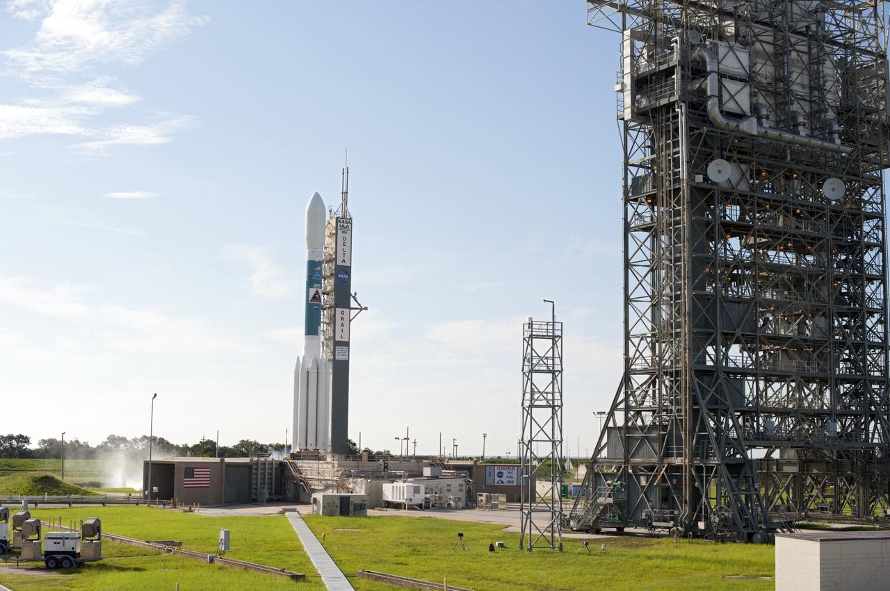 CAPE CANAVERAL, Fla. – Engine ignition begins liftoff of the United Launch Alliance Delta II Heavy rocket carrying NASA’s twin Gravity Recovery and Interior Laboratory (GRAIL) mission off Space Launch Complex 17B on Cape Canaveral Air Force Station in Florida. At right is the pad’s mobile service tower. The spacecraft launched at 9:08:52 a.m. EDT Sept. 10. GRAIL-A will separate from the second stage of the rocket at about one hour, 21 minutes after liftoff, followed by GRAIL-B at 90 minutes after launch. The spacecraft are embarking on a three-month journey to reach the moon.    GRAIL will fly twin spacecraft in tandem around the moon to precisely measure and map variations in the moon's gravitational field. The mission will provide the most accurate global gravity field to date for any planet, including Earth. This detailed information will reveal differences in the density of the moon's crust and mantle and will help answer fundamental questions about the moon's internal structure, thermal evolution, and history of collisions with asteroids. The aim is to map the moon's gravity field so completely that future moon vehicles can safely navigate anywhere on the moon’s surface. For more information, visit http://www.nasa.gov/grail. Photo credit: NASA/Tom Farrar and Tony Gray