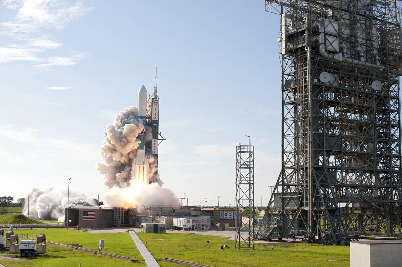 CAPE CANAVERAL, Fla. – Flames and smoke from the engines surround the United Launch Alliance Delta II rocket at liftoff carrying NASA’s twin Gravity Recovery and Interior Laboratory (GRAIL) mission off Space Launch Complex 17B on Cape Canaveral Air Force Station in Florida. At right is the pad’s mobile service tower. The spacecraft launched at 9:08:52 a.m. EDT Sept. 10. GRAIL-A will separate from the second stage of the rocket at about one hour, 21 minutes after liftoff, followed by GRAIL-B at 90 minutes after launch. The spacecraft are embarking on a three-month journey to reach the moon.    GRAIL will fly twin spacecraft in tandem around the moon to precisely measure and map variations in the moon's gravitational field. The mission will provide the most accurate global gravity field to date for any planet, including Earth. This detailed information will reveal differences in the density of the moon's crust and mantle and will help answer fundamental questions about the moon's internal structure, thermal evolution, and history of collisions with asteroids. The aim is to map the moon's gravity field so completely that future moon vehicles can safely navigate anywhere on the moon’s surface. For more information, visit http://www.nasa.gov/grail. Photo credit: NASA/Tom Farrar and Tony Gray