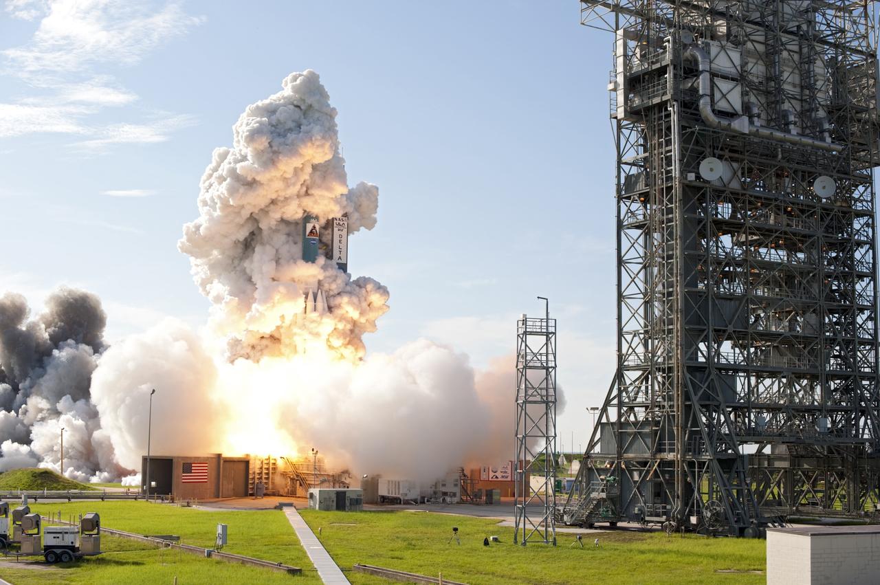 CAPE CANAVERAL, Fla. – Plumes of smoke surround of the United Launch Alliance Delta II Heavy rocket carrying NASA’s twin Gravity Recovery and Interior Laboratory (GRAIL) mission off Space Launch Complex 17B on Cape Canaveral Air Force Station in Florida. At right is the pad’s mobile service tower. The spacecraft launched at 9:08:52 a.m. EDT Sept. 10. GRAIL-A will separate from the second stage of the rocket at about one hour, 21 minutes after liftoff, followed by GRAIL-B at 90 minutes after launch. The spacecraft are embarking on a three-month journey to reach the moon.    GRAIL will fly twin spacecraft in tandem around the moon to precisely measure and map variations in the moon's gravitational field. The mission will provide the most accurate global gravity field to date for any planet, including Earth. This detailed information will reveal differences in the density of the moon's crust and mantle and will help answer fundamental questions about the moon's internal structure, thermal evolution, and history of collisions with asteroids. The aim is to map the moon's gravity field so completely that future moon vehicles can safely navigate anywhere on the moon’s surface. For more information, visit http://www.nasa.gov/grail. Photo credit: NASA/Tom Farrar and Tony Gray