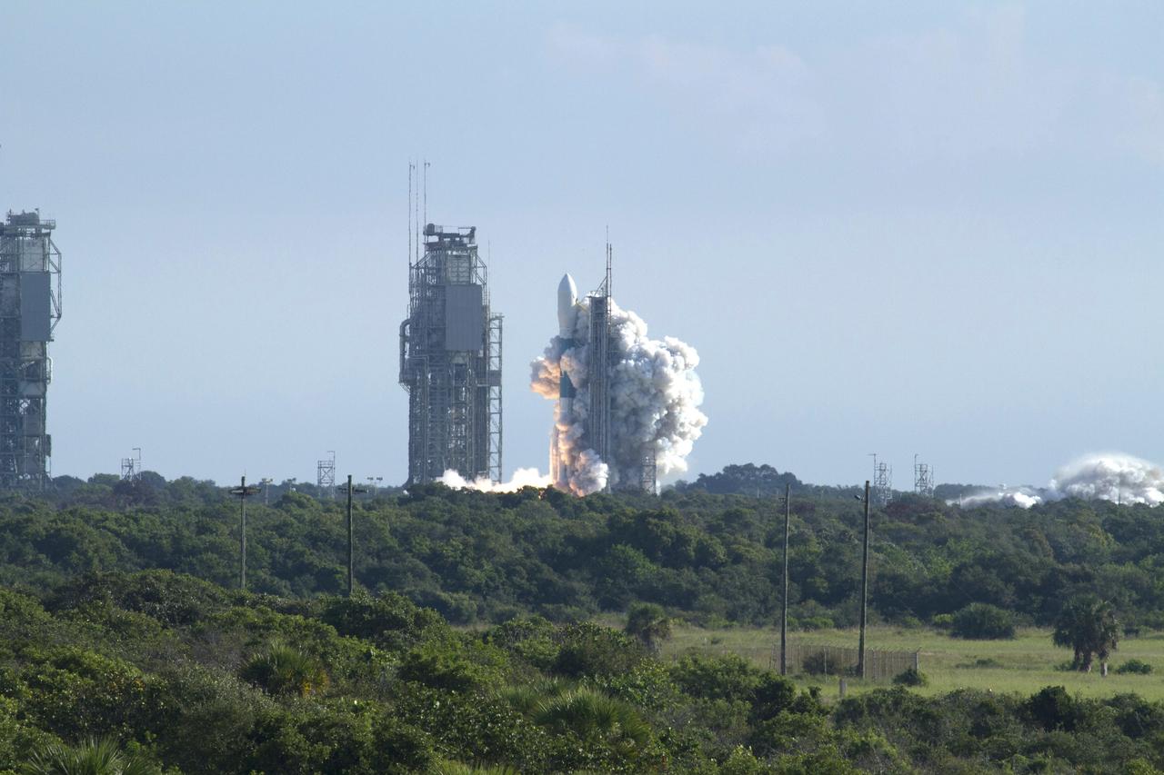 CAPE CANAVERAL, Fla. – Over a group of trees and bushes, the United Launch Alliance Delta II Heavy rocket carrying NASA’s twin Gravity Recovery and Interior Laboratory (GRAIL) mission launches off Space Launch Complex 17B on Cape Canaveral Air Force Station in Florida. At left is the pad’s mobile service tower. The spacecraft launched at 9:08:52 a.m. EDT Sept. 10. GRAIL-A will separate from the second stage of the rocket at about one hour, 21 minutes after liftoff, followed by GRAIL-B at 90 minutes after launch. The spacecraft are embarking on a three-month journey to reach the moon.    GRAIL will fly twin spacecraft in tandem around the moon to precisely measure and map variations in the moon's gravitational field. The mission will provide the most accurate global gravity field to date for any planet, including Earth. This detailed information will reveal differences in the density of the moon's crust and mantle and will help answer fundamental questions about the moon's internal structure, thermal evolution, and history of collisions with asteroids. The aim is to map the moon's gravity field so completely that future moon vehicles can safely navigate anywhere on the moon’s surface. For more information, visit http://www.nasa.gov/grail. Photo credit: NASA/Kenny Allen