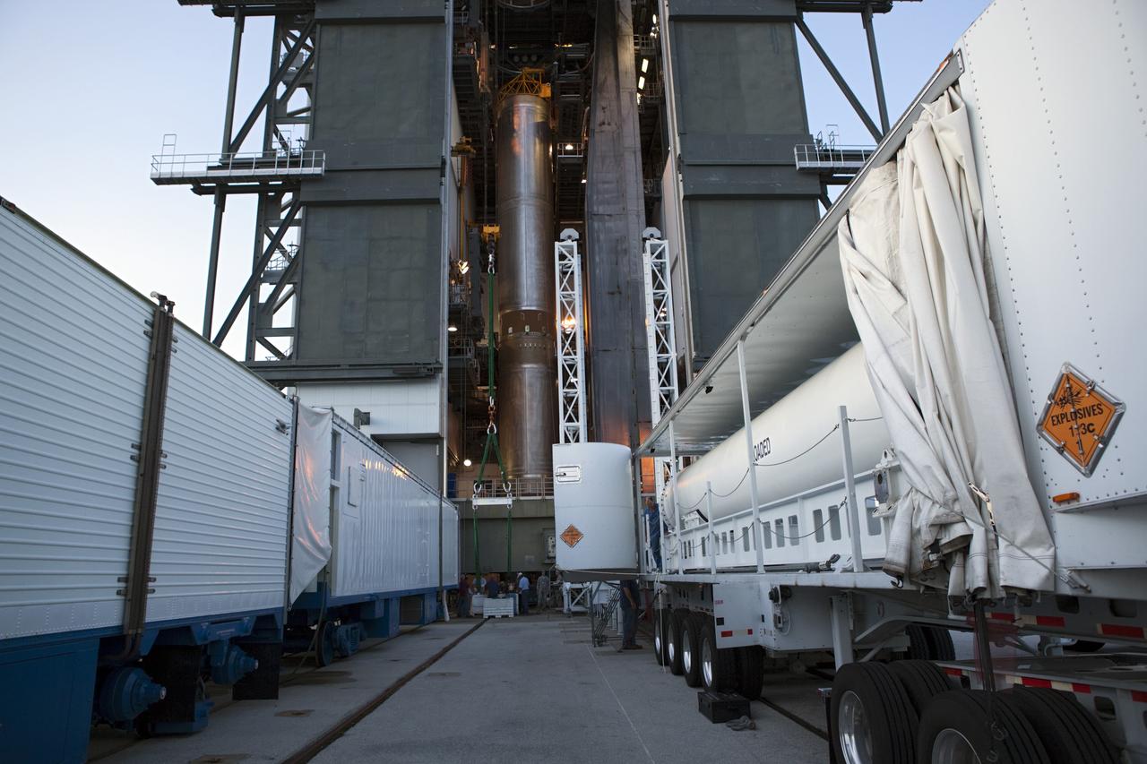 CAPE CANAVERAL, Fla. -- At the Vertical Integration Facility at Space Launch Complex 41 on Cape Canaveral Air Force Station in Florida, a trailer carrying a solid rocket motor (SRM) awaits unloading. The SRM will be mated to a United Launch Alliance Atlas V rocket being prepared to launch NASA's Mars Science Laboratory (MSL) mission.      MSL's components include a compact car-sized rover, Curiosity, which has 10 science instruments designed to search for evidence on whether Mars has had environments favorable to microbial life, including chemical ingredients for life.  The unique rover will use a laser to look inside rocks and release its gasses so that the rover’s spectrometer can analyze and send the data back to Earth. MSL is scheduled to launch Nov. 25 with a window extending to Dec. 18 and arrival at Mars Aug. 2012. For more information, visit http://www.nasa.gov/msl. Photo credit: NASA/Dimitri Gerondidakis
